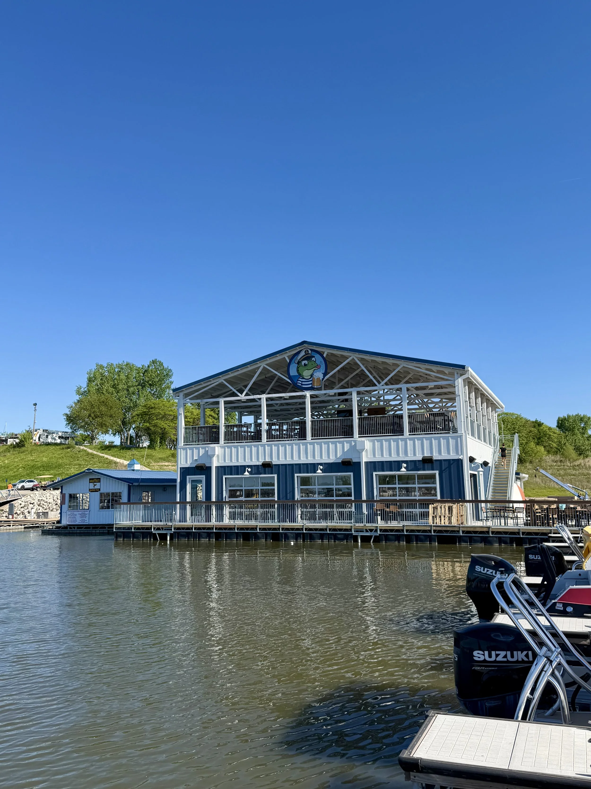 Exterior wide shot of The Soggy Frog Marina Bar, Saylorville Lake, Iowa