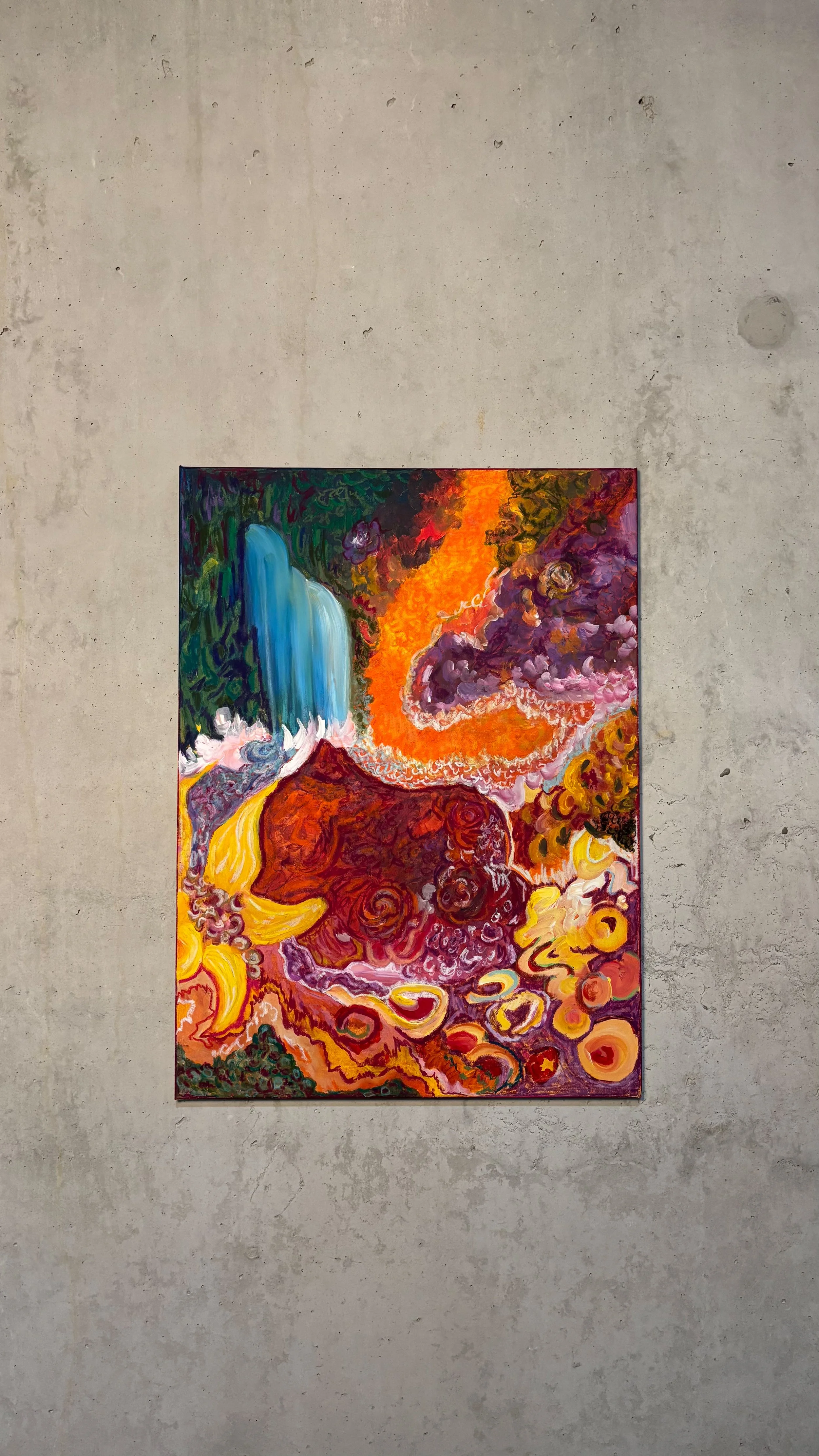 A colorful abstract painting on a wall with swirling patterns and vibrant colors including blue, orange, red, purple, and yellow.