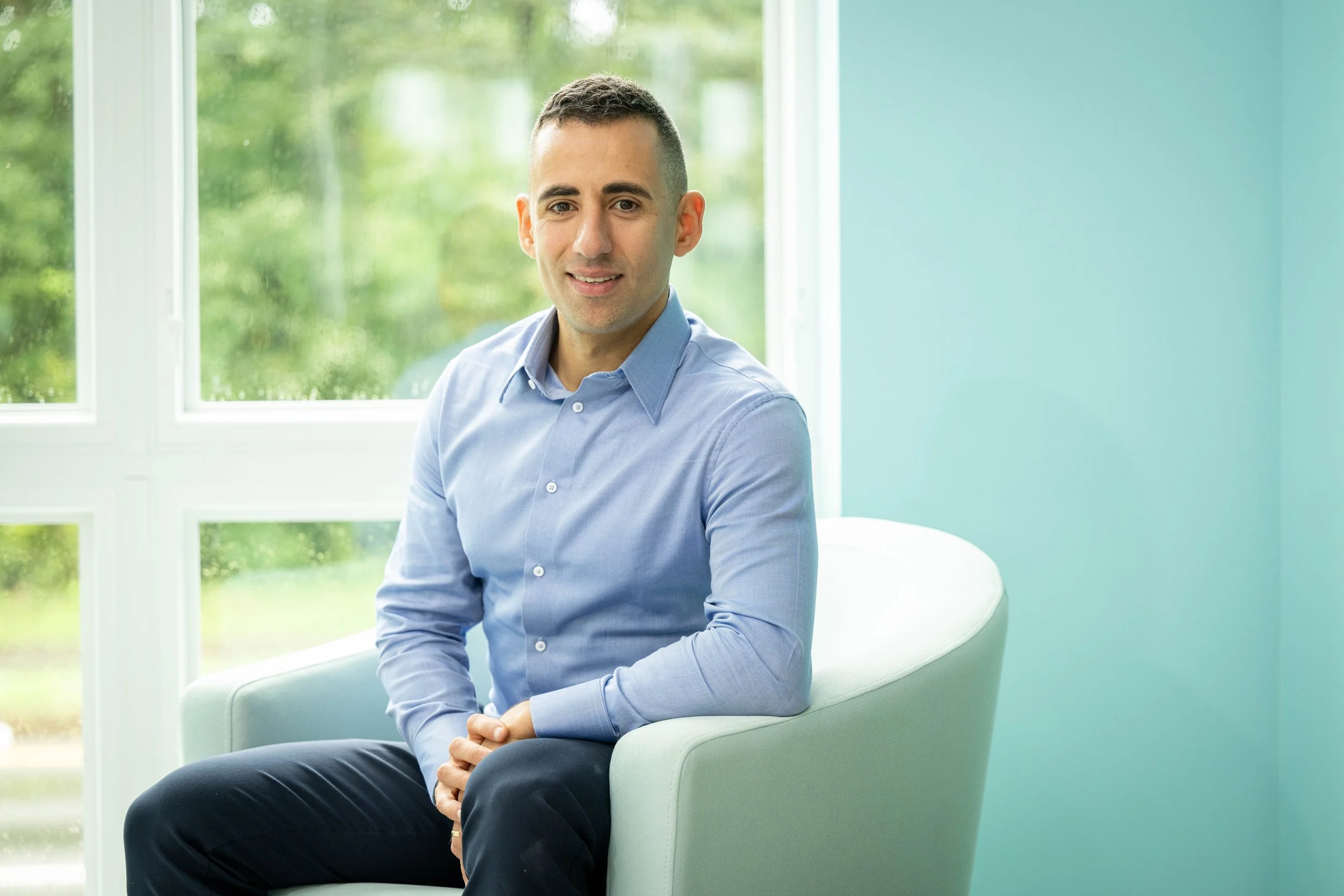 Philip Cohen sitting in an armchair