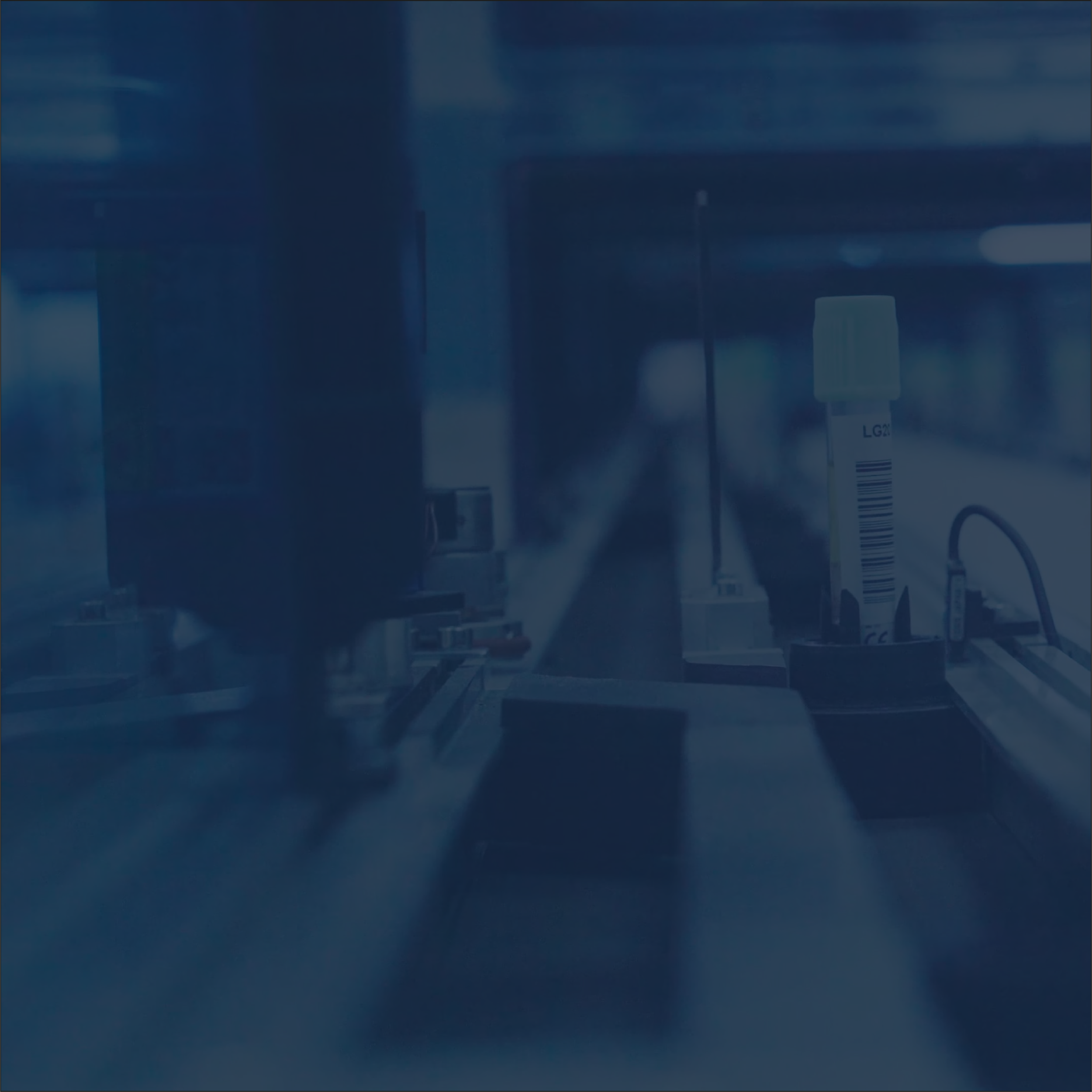 Laboratory equipment with a test tube and machinery for scientific analysis.