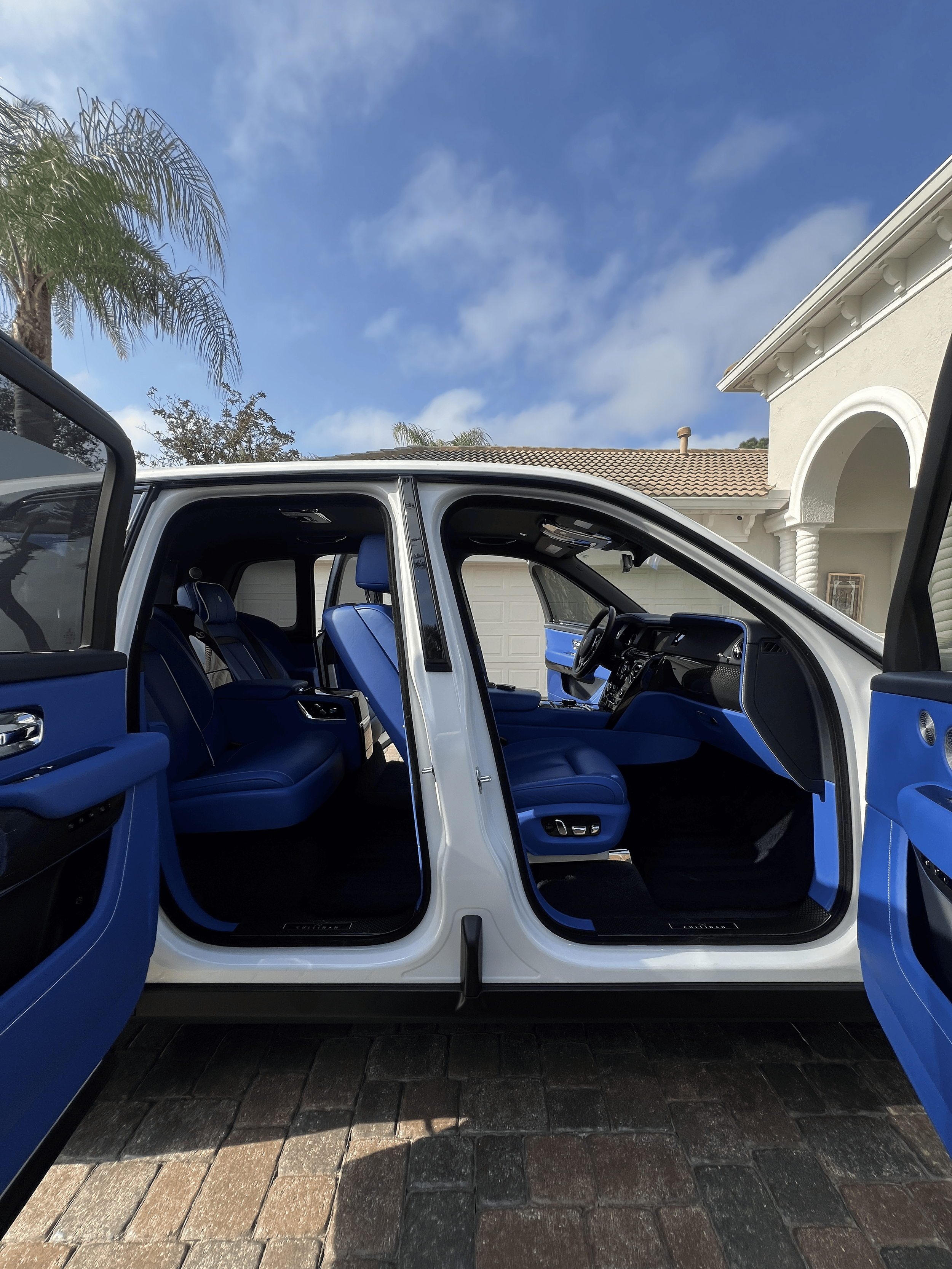 Rolls-Royce Cullinan interior detailing with blue leather seats Tampa FL mobile detailer