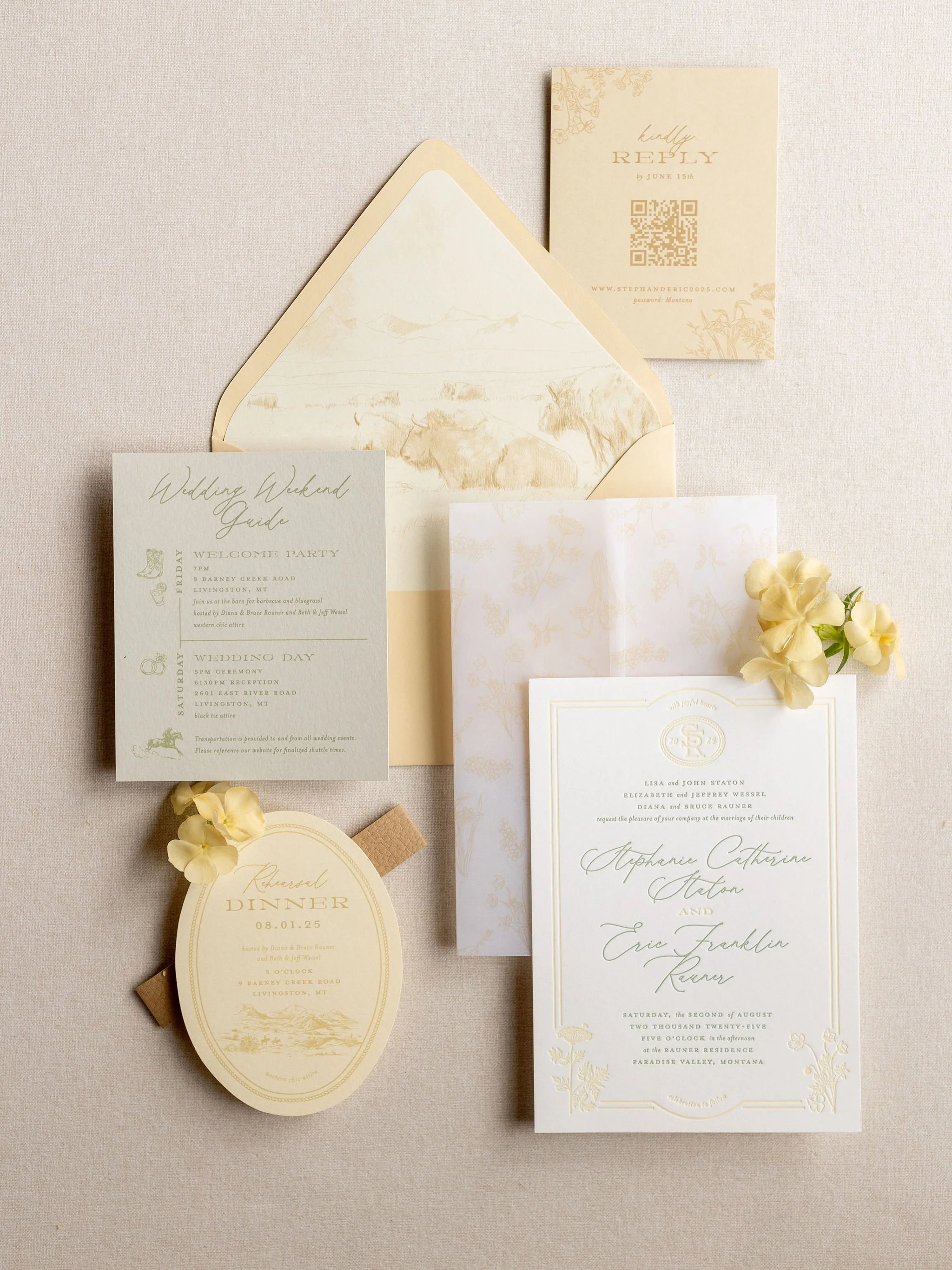 Wedding stationery flatlay with invitation suite, menu cards, and small floral accent on a neutral background