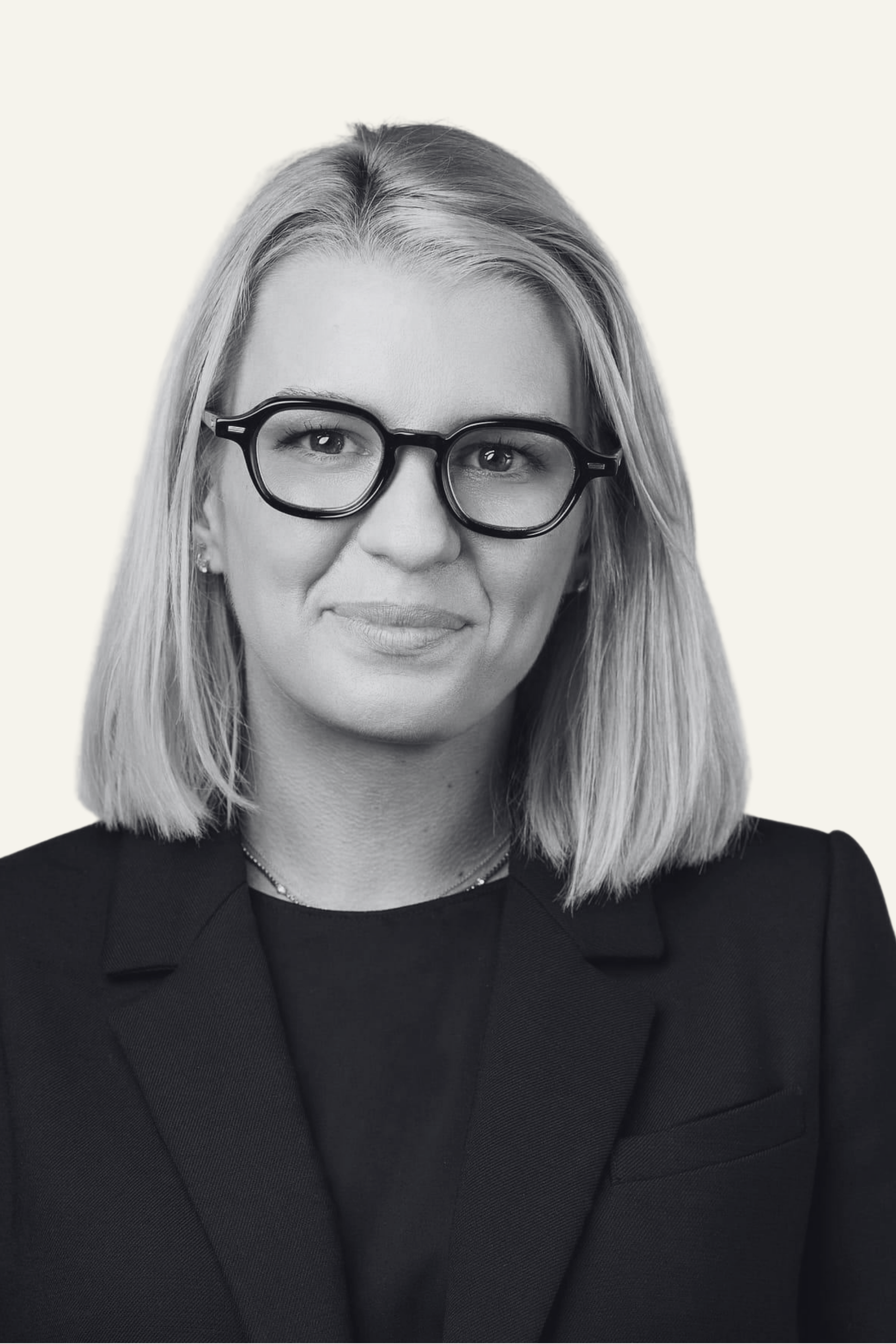 Professional executive portrait of a business leader in modern eyewear, representing The Lockett Circle’s commitment to leadership, expertise, and trusted advisory.