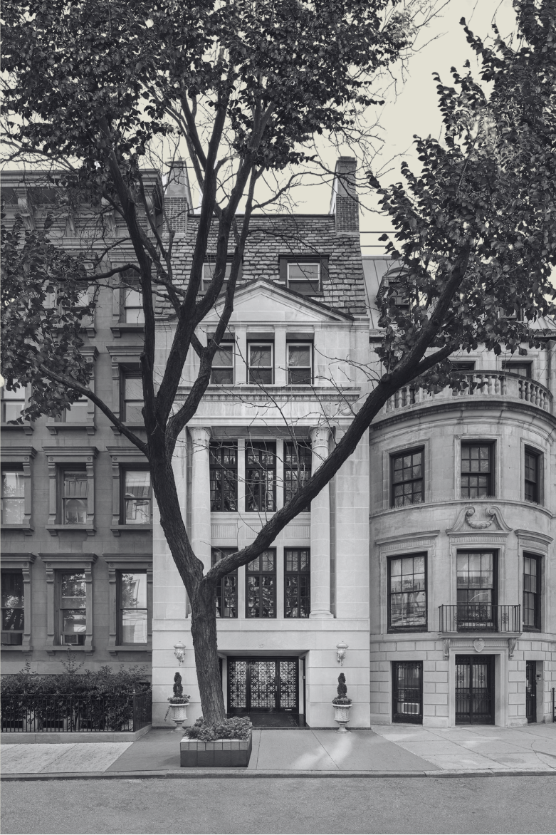 Elegant historic townhouse with classical columns and refined urban architecture, representing The Lockett Circle’s focus on timeless luxury real estate and legacy living.