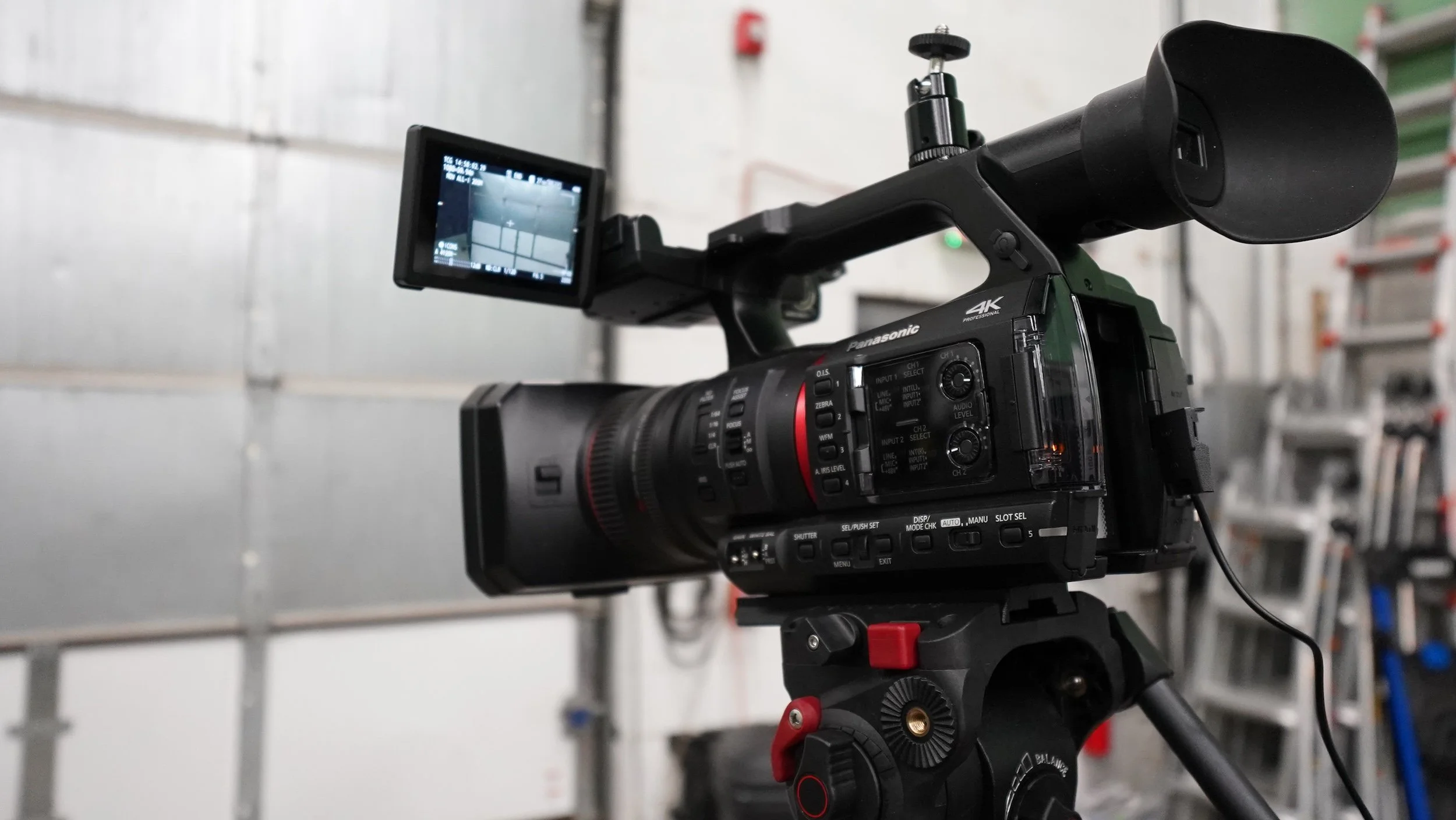 A professional video camera mounted on a tripod  - HSP event production in Boston MA