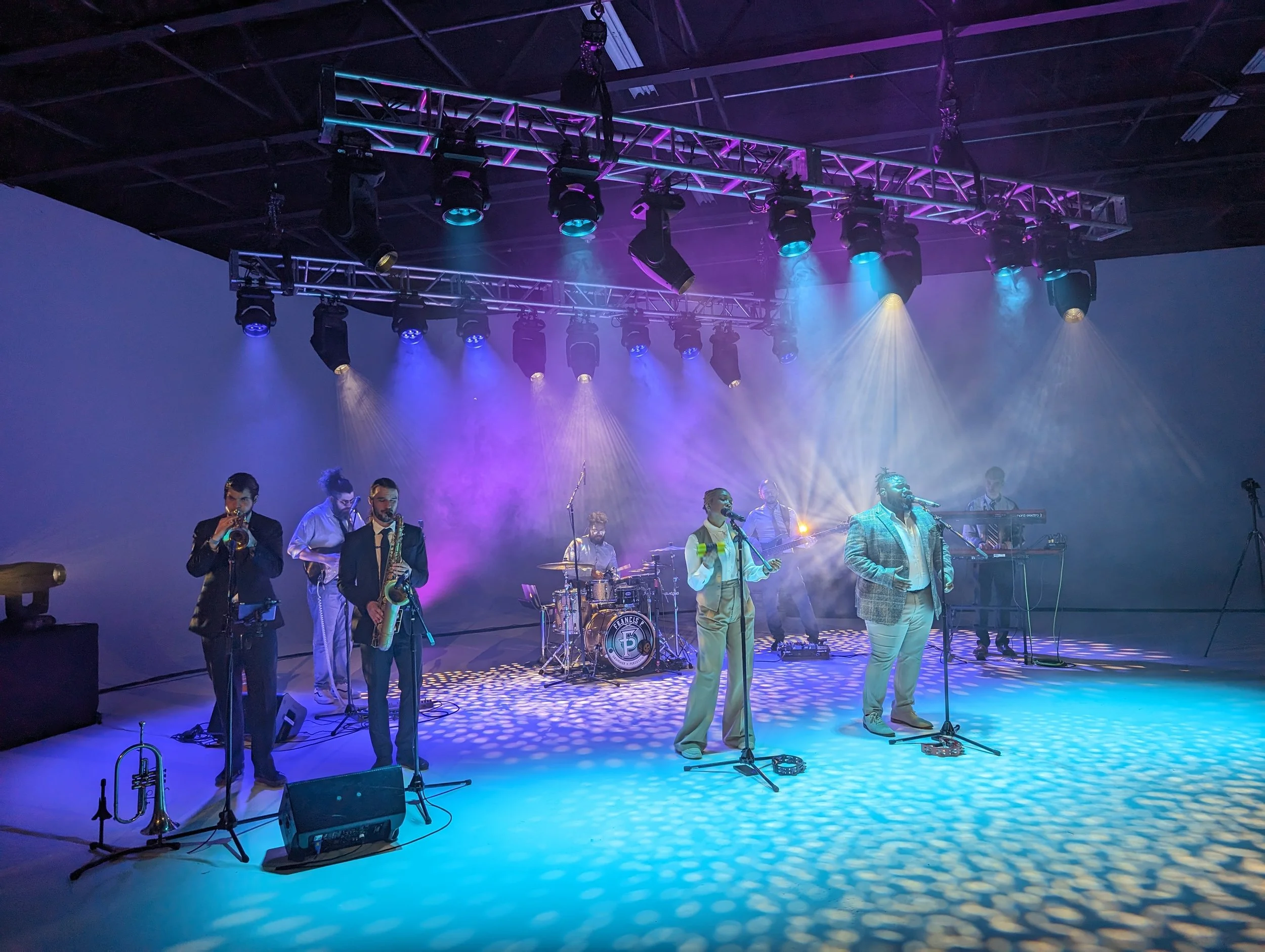 A band of seven musicians performs on a stage - HSP event production in Boston MA - live music