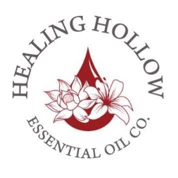 Logo for Healing Hollow Essential Oil Co. featuring a red drop and floral design.