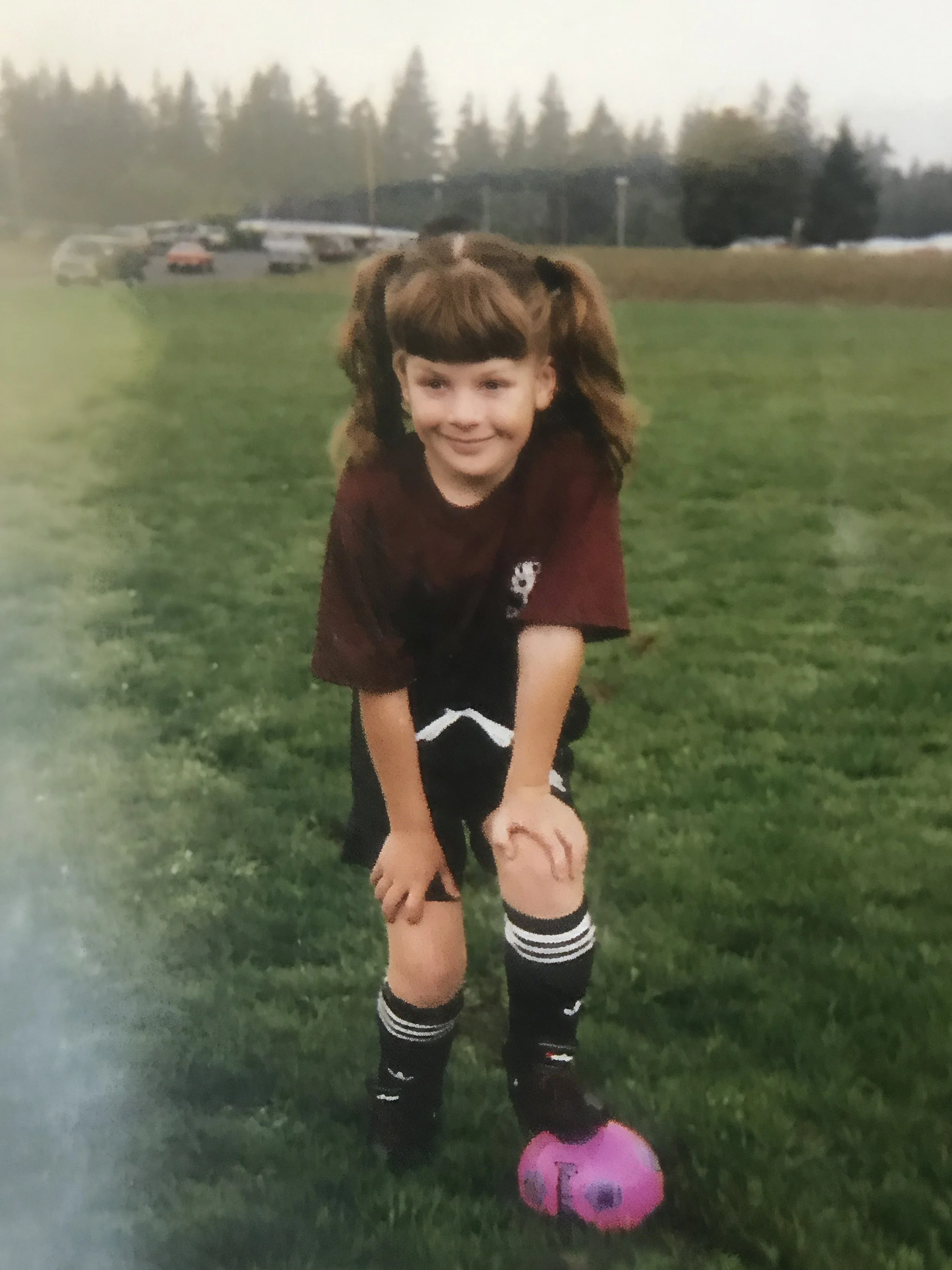 A childhood photo of Leah Flores playing soccer. She is the photographer behind Rare Day Photo