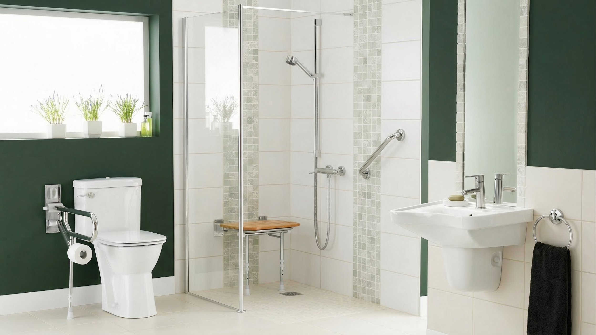 Accessible bathroom with a white toilet, a walk-in shower with a wooden seat, and a white sink, all in a bright room with green and white walls and a large window with three potted plants.