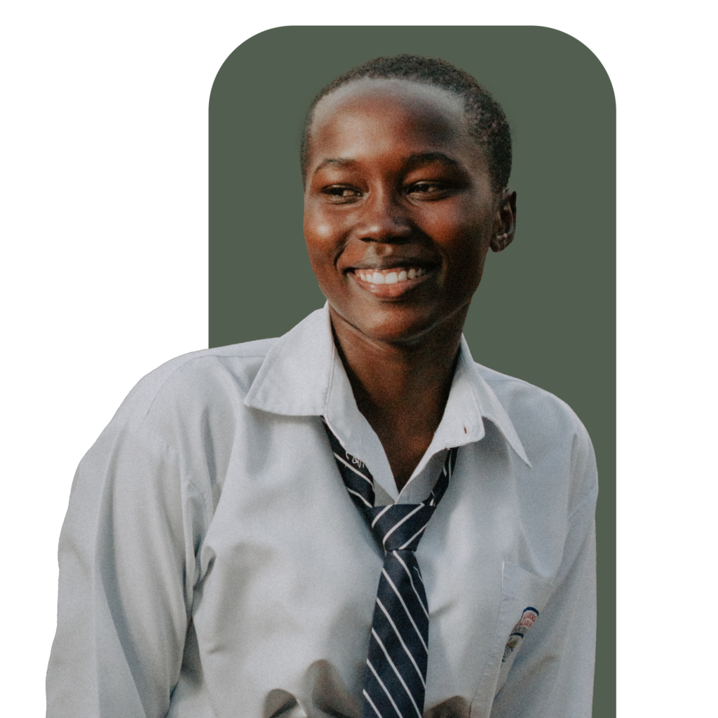 Smiling young woman in school uniform with a white shirt and striped tie