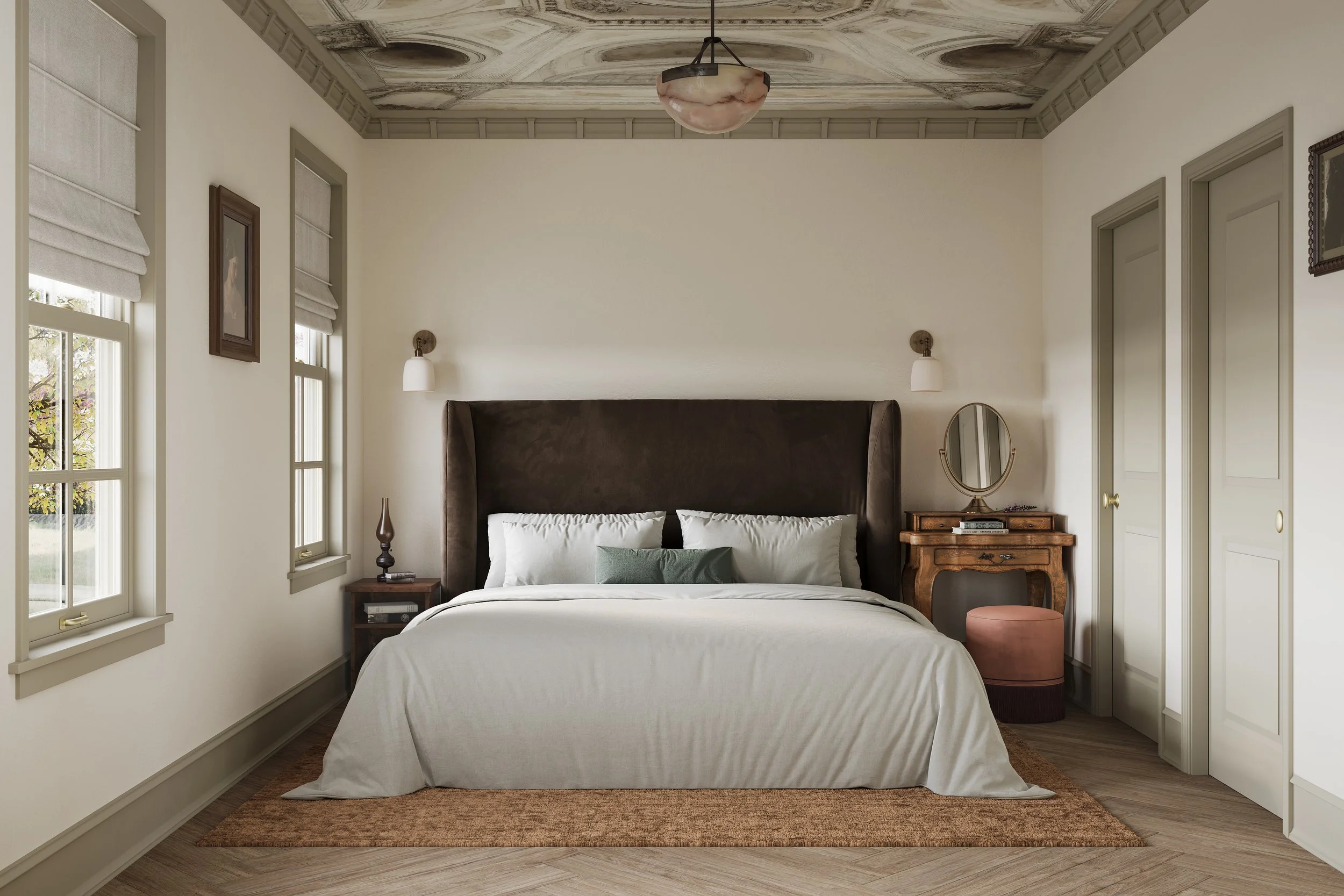 A cozy bedroom with a large bed with white bedding, green and white pillows, dark headboard, and two bedside tables with lamps. There are three windows with white Roman shades, and a mirror on the right. The ceiling has decorative molding and a hangi