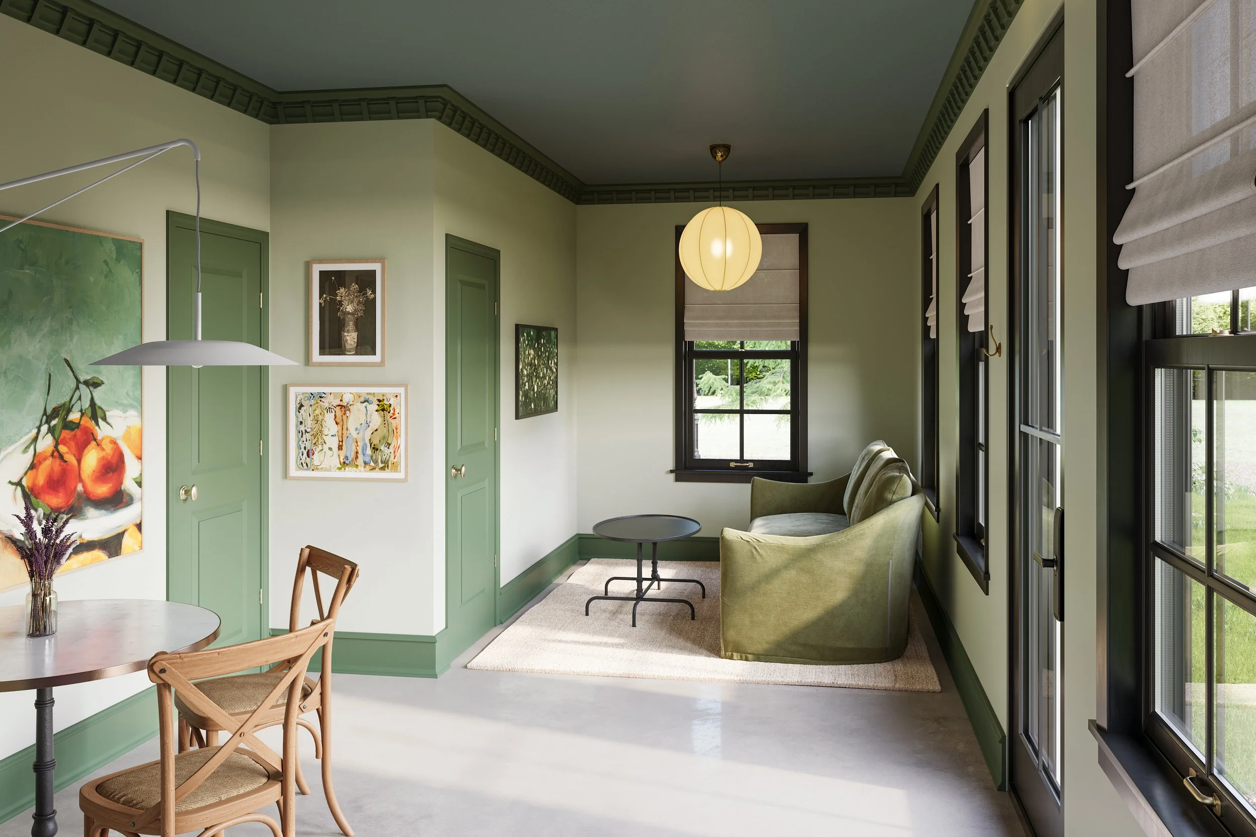 A cozy living room with mint green walls and matching green window frames, decorated with framed artwork including a still life of peaches, a floral photo, and an abstract piece. The room has large windows with beige Roman shades, a hanging paper lan
