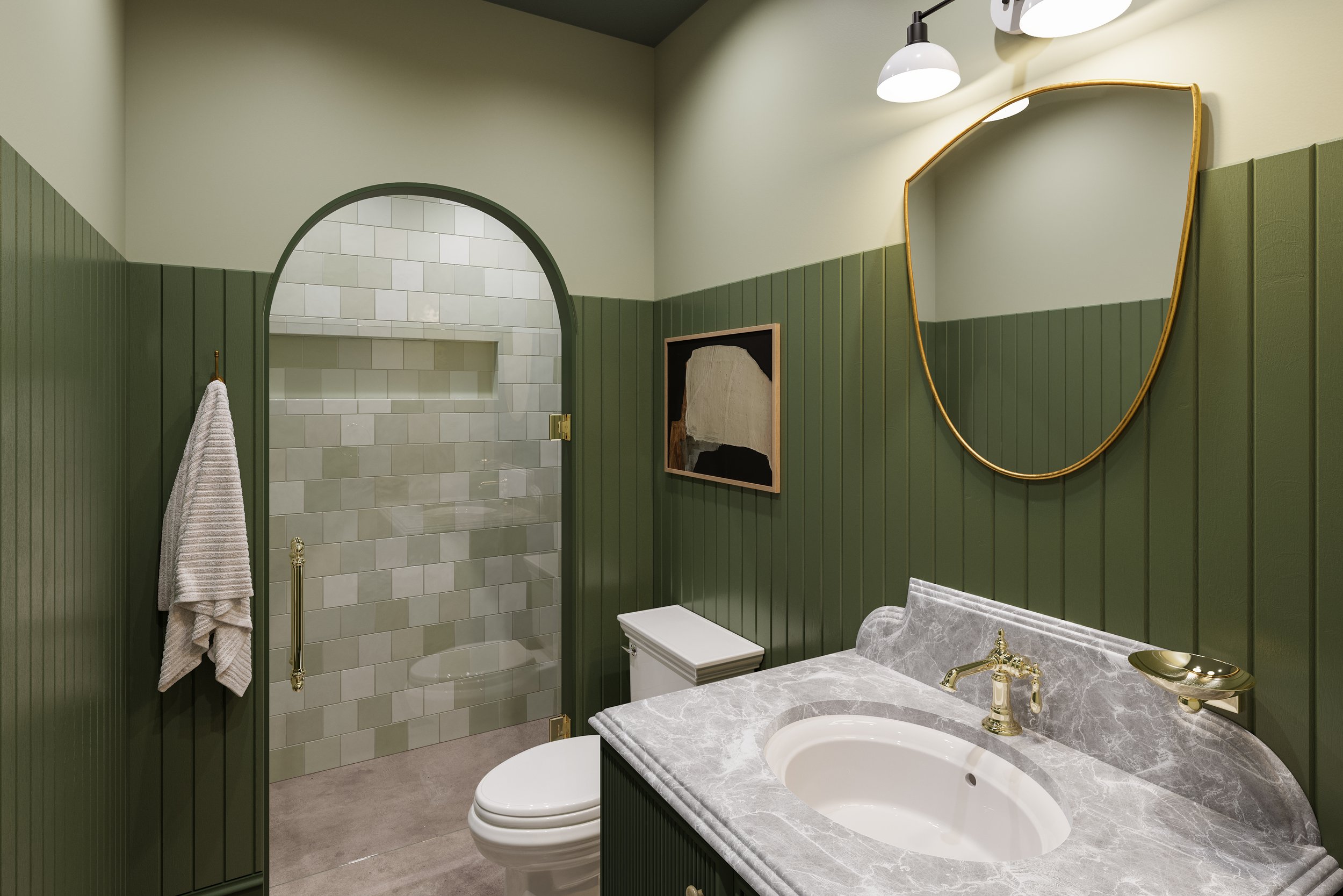 A bathroom with green wood-paneled walls, a marble countertop with a gold faucet, a mirror with an irregular gold frame, a white toilet, a decorative painting, and a walk-in shower with beige tiles and a towel hanging on a hook.