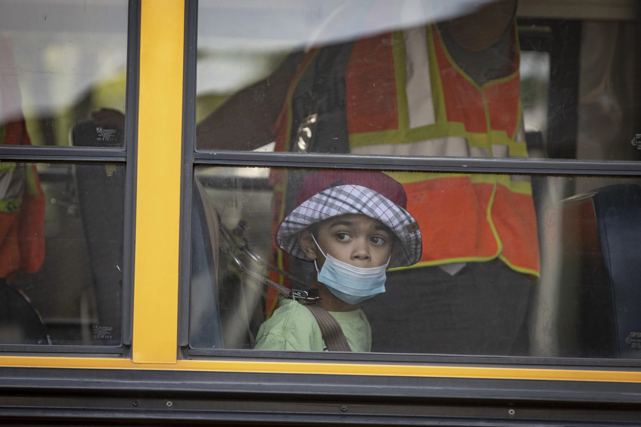 A student arrives by school bus to Spring Valley Elementary School, in Ancaster, Ont., on Sept. 8, 2021 — the first day back to in-person learning.