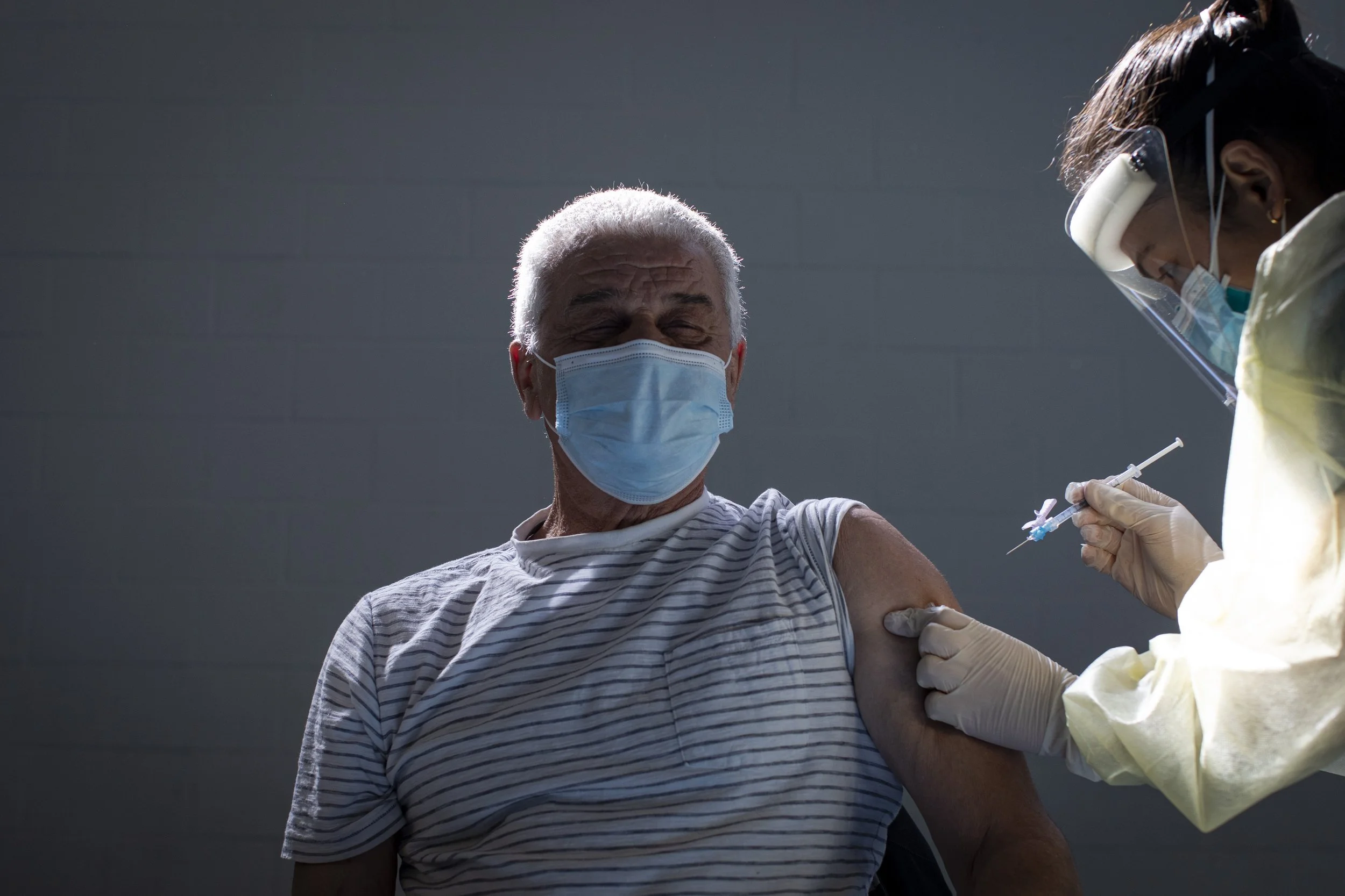 First dose, Orlando Mosca, 71, St. Fidelis Parish church, Toronto, Apr. 7, 2021.