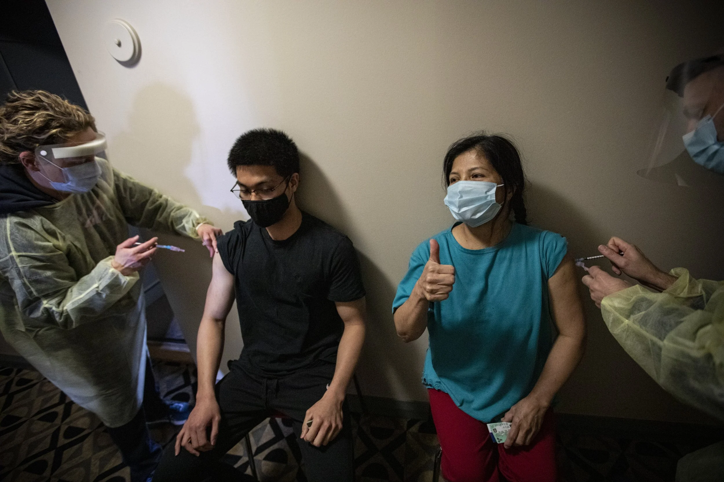Residents of the city-run San Romanoway apartment, in Toronto's Jane and Finch neighbourhood, get vaccinated on Apr. 21, 2021.