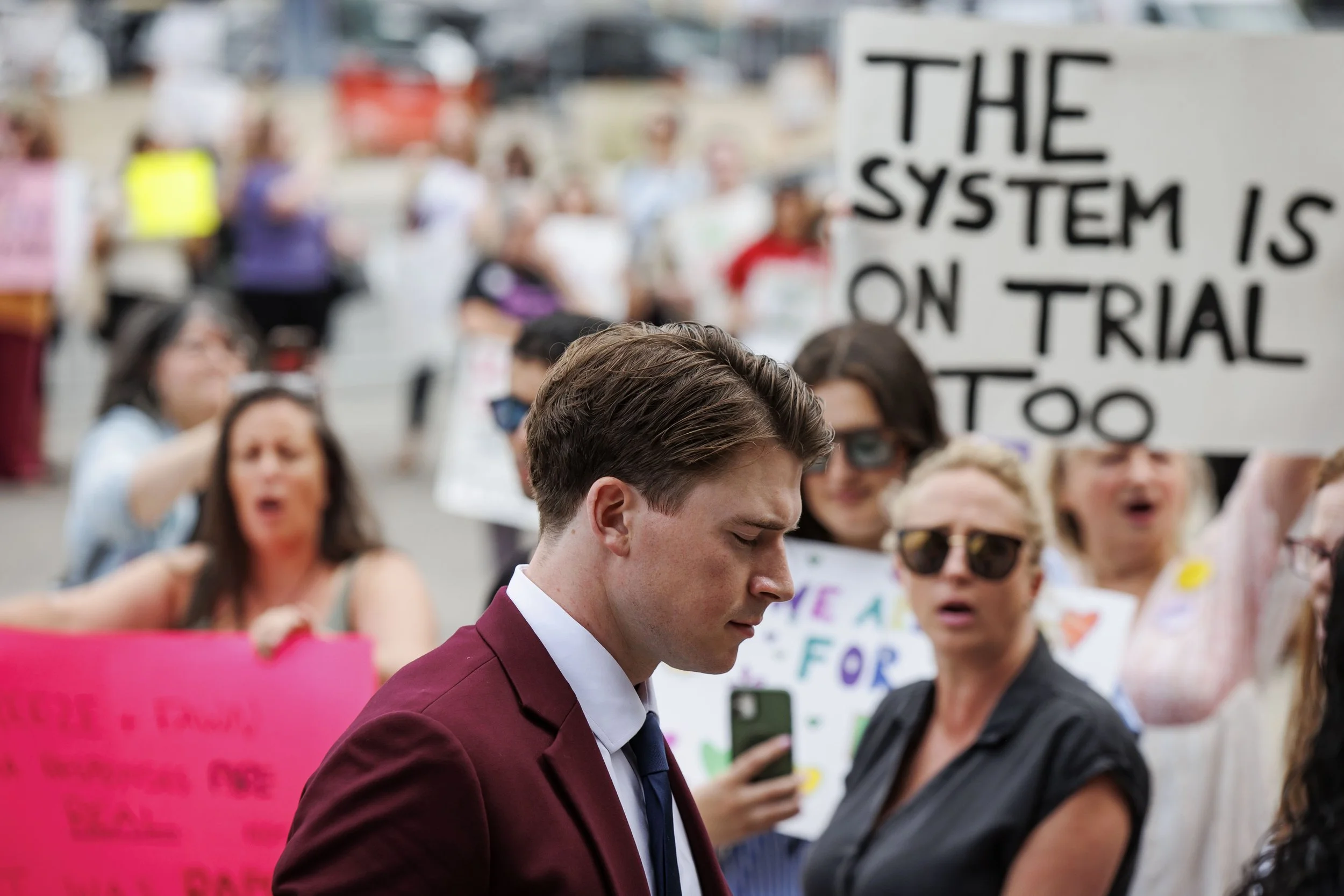 Carter Hart enters a London, Ont., courthouse during a sexual assault trial involving 5 world junior hockey players, July 24, 2025.