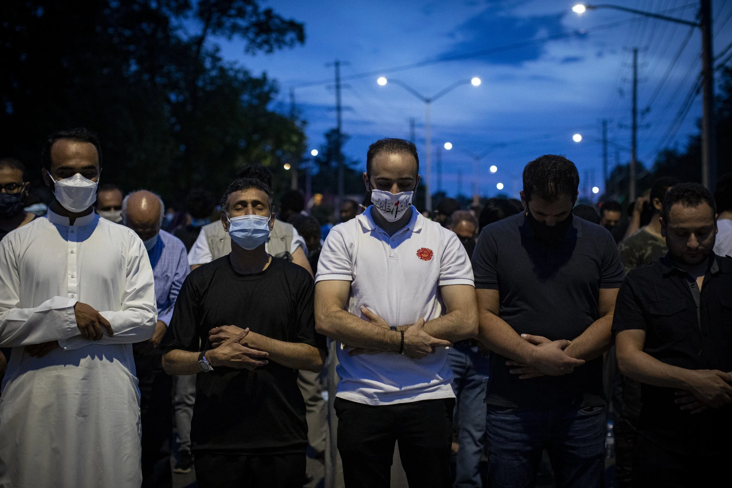 Thousands attend a vigil for a family killed in a terror attack outside a London, Ont., mosque on Jun. 8, 2021. The proceedings were held outdoors to mitigate the spread of COVID-19.