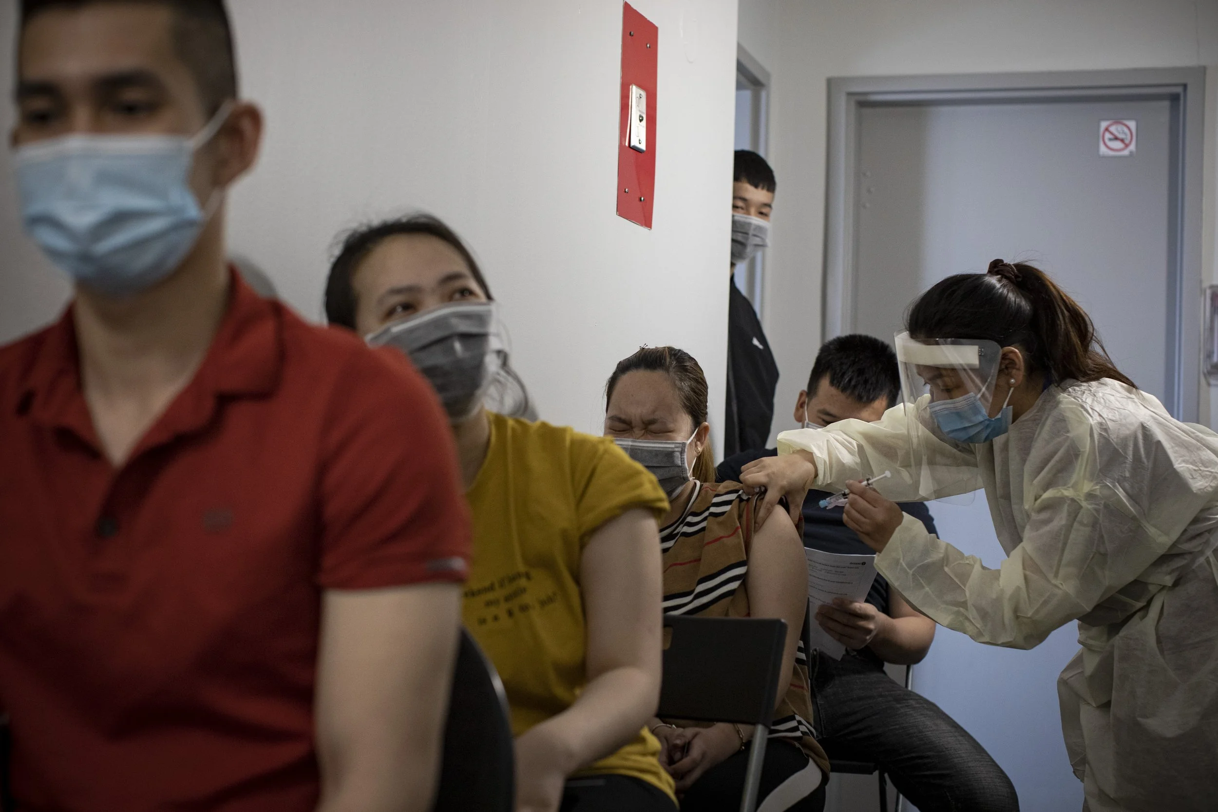 Humber River Hospital nurses administer the shots o residents of the San Romanoway apartments, in Toronto, on Apr. 21, 2021.