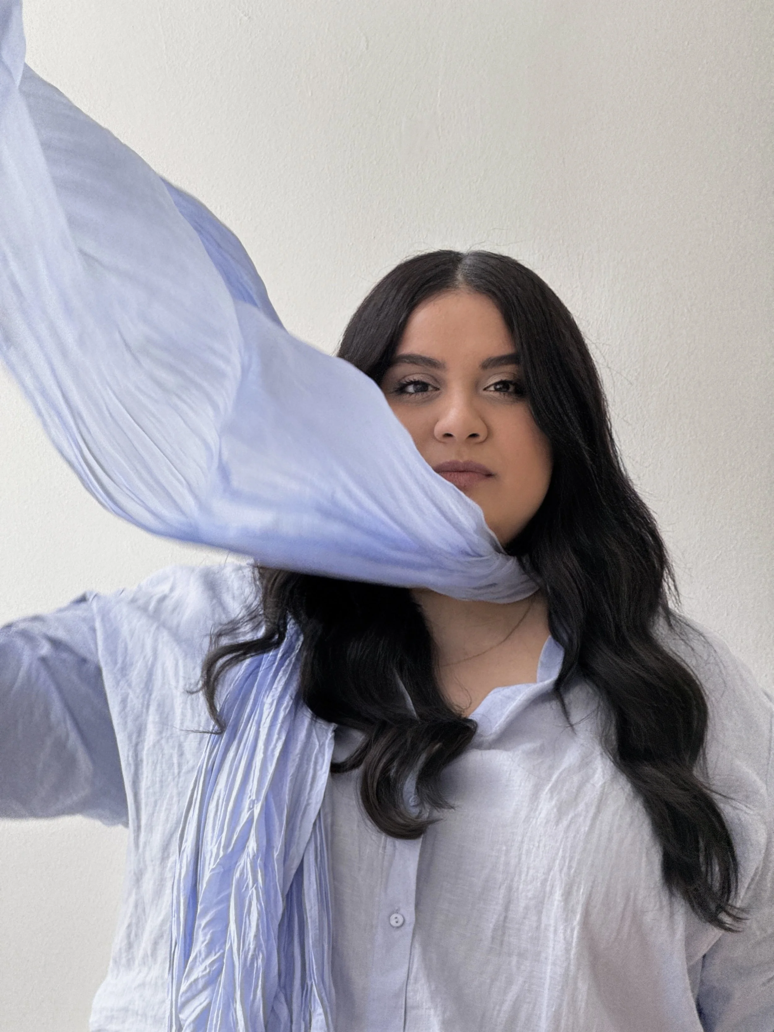 Hina 'Heensie' Low, a size inclusive personal stylist, wearing a textural lavender top and matching scarf in a professional creative headshot.