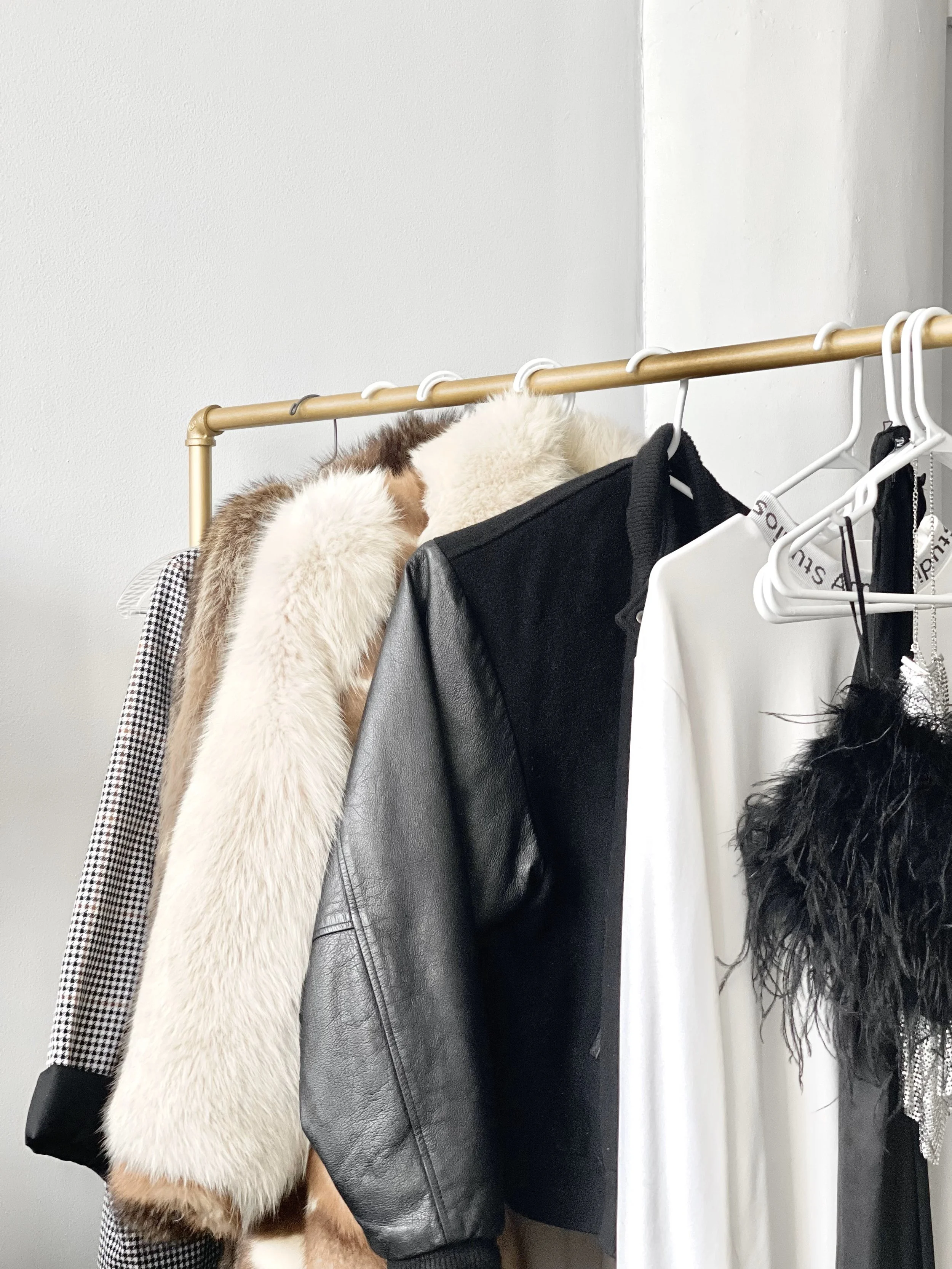 A photo of a phone showing a Pinterest board depicting fashion inspiration on plus sized bodies.