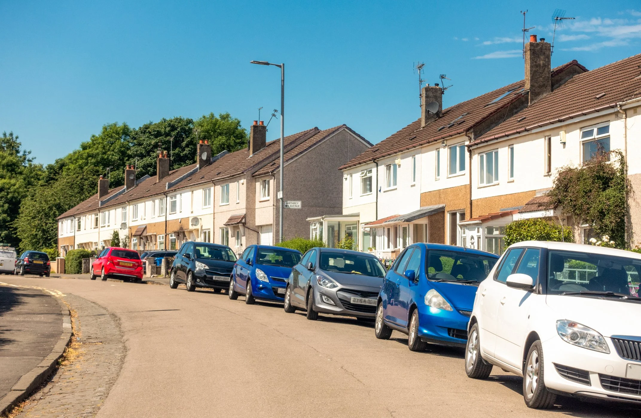 Residential street with multiple homes covered by local property inspection services