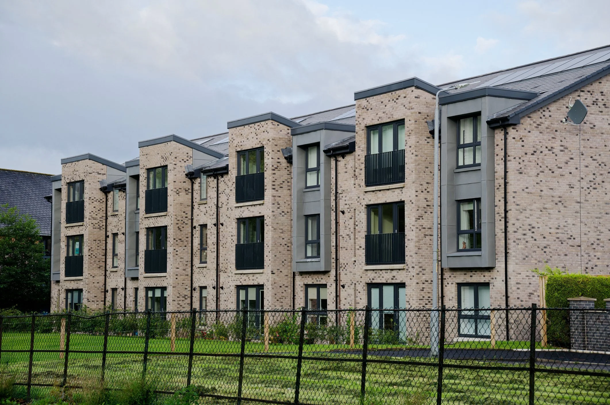 Modern apartment building suitable for new build and property inspection services