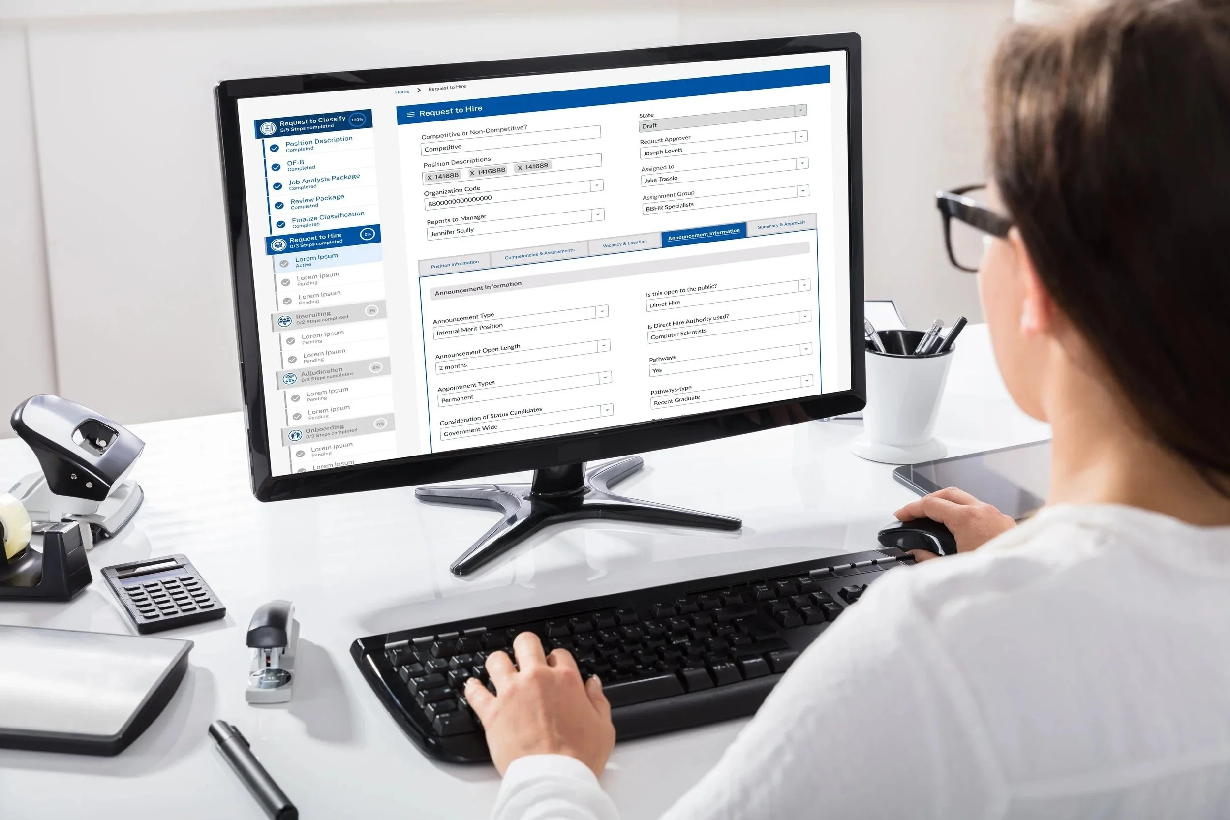 A person working at a computer in an office, viewing in a workspace that helps automate their workflows.
