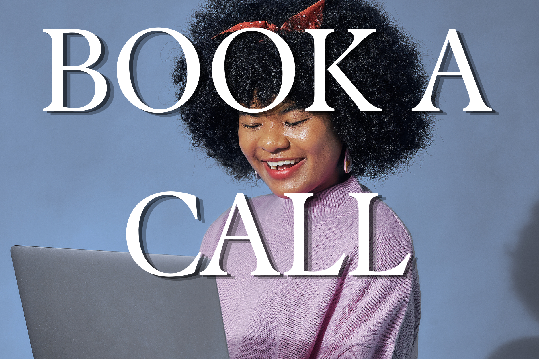 A woman with curly black hair, wearing a pink top, smiling while looking at her laptop, with large white text overlay reading 'Book a Call'.