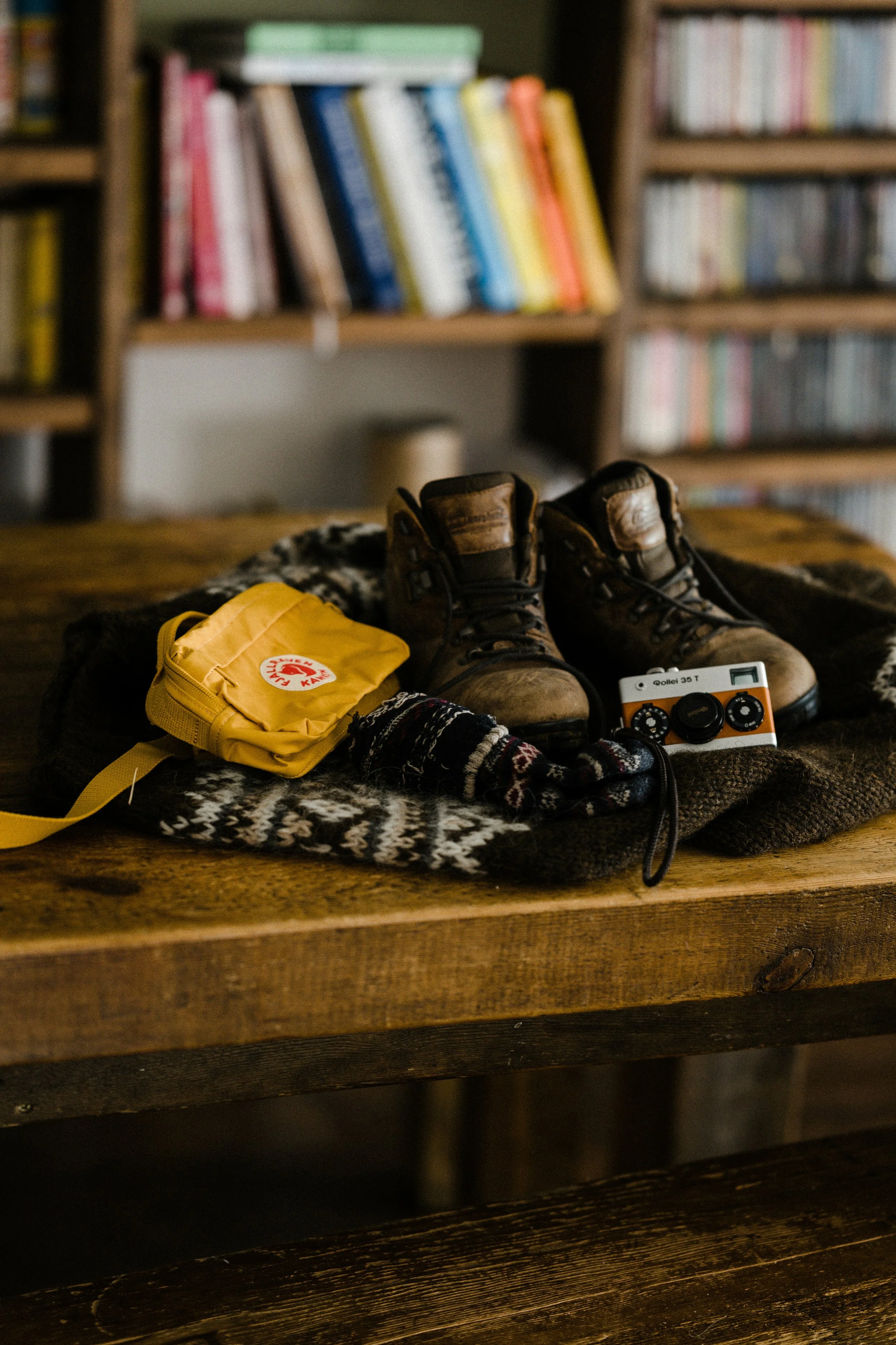 Hiking boots and a yellow bag on a knitted sweater ready for an occupational therapy session in Kamloops BC