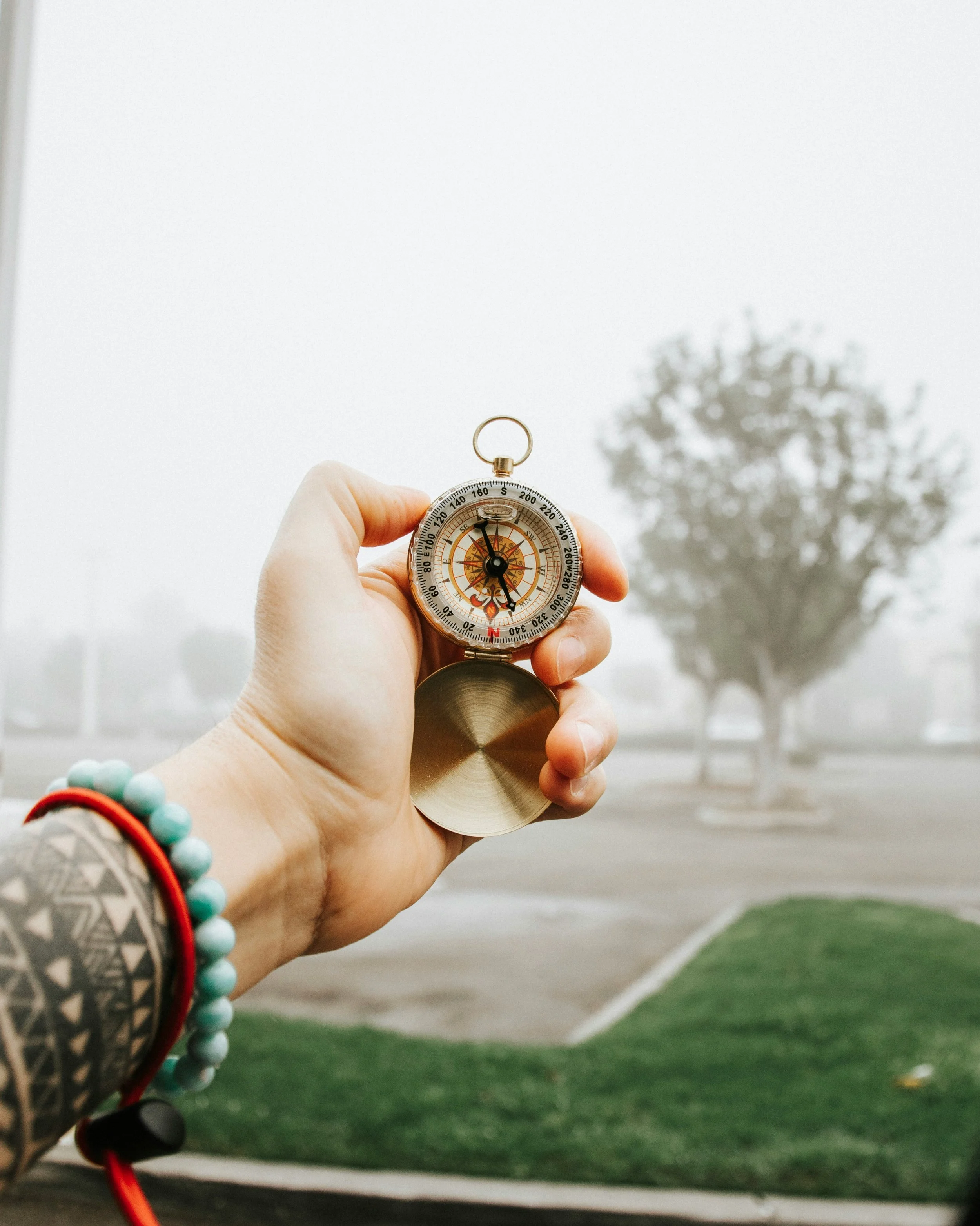 A brass compass in a hand during occupational therapy in Kelowna British Columbia