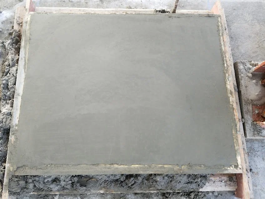 Freshly poured concrete slab on a construction site.