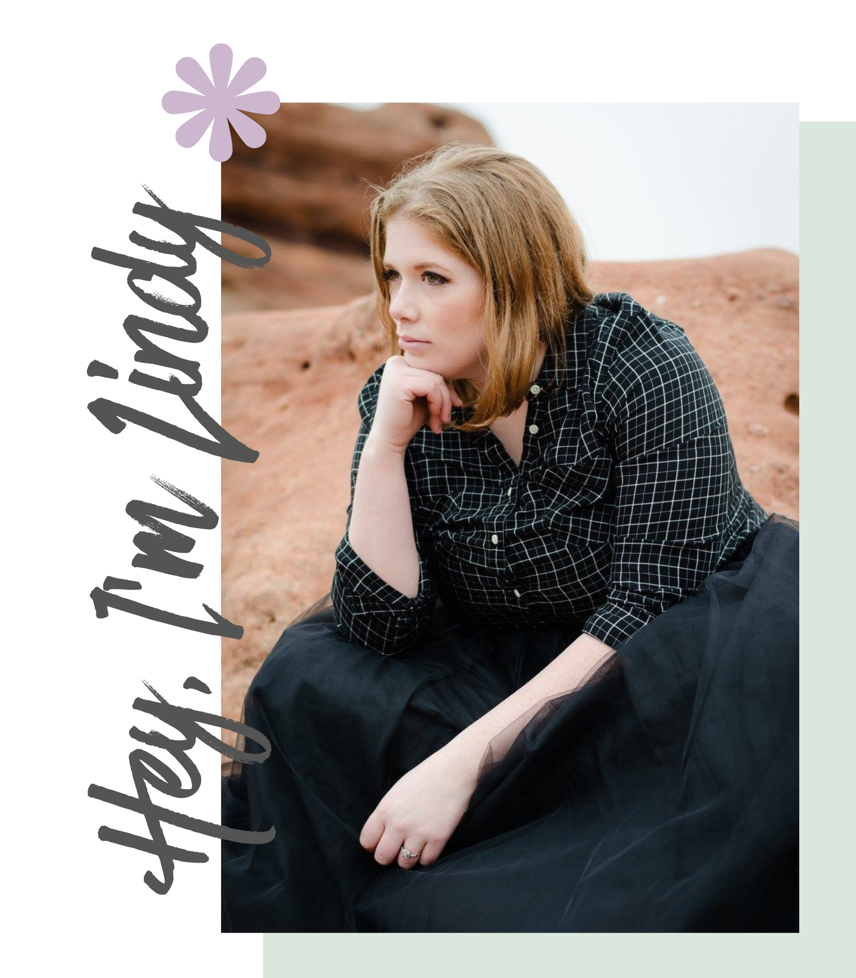 A woman with light brown hair sitting outdoors on a reddish rock formation, resting her chin on her hand, looking thoughtfully into the distance.