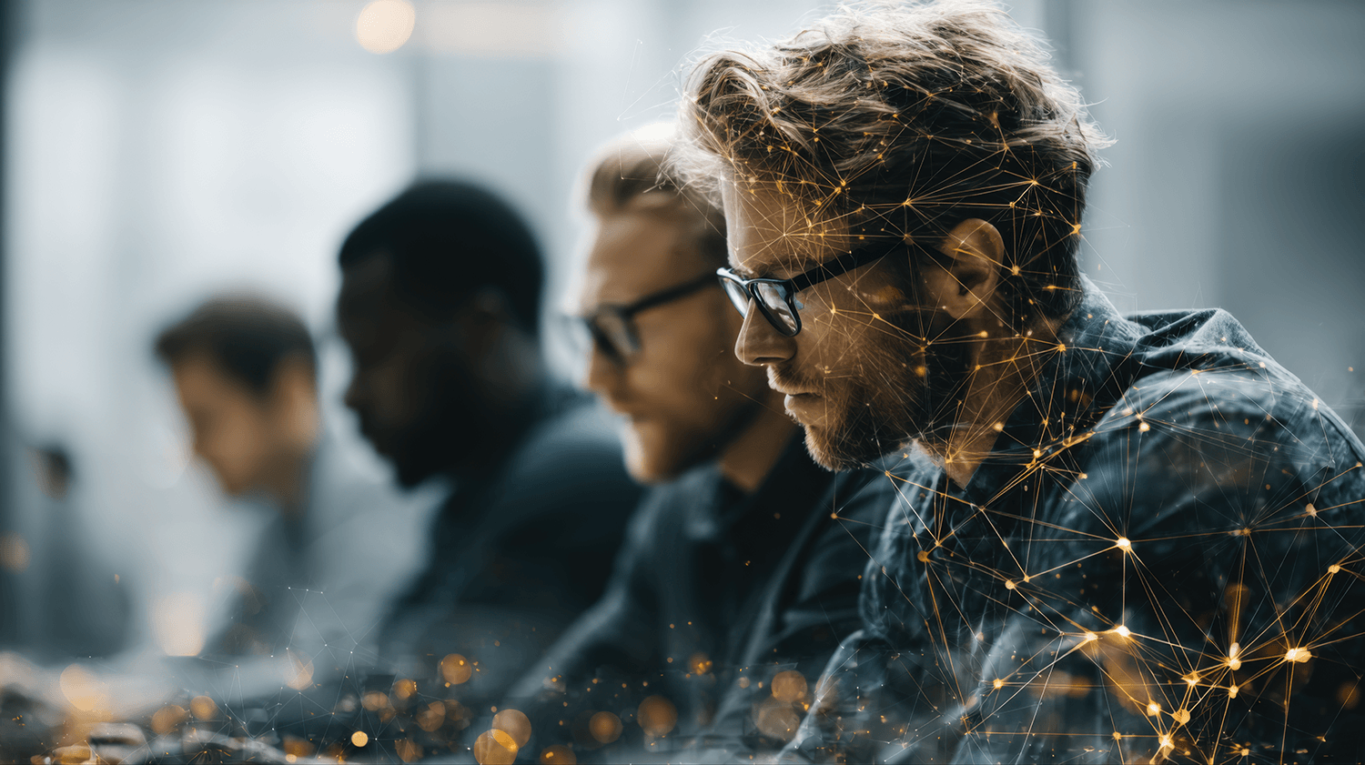 Business people sitting at a conference table, focusing on their laptop screens, with a digital network overlay.