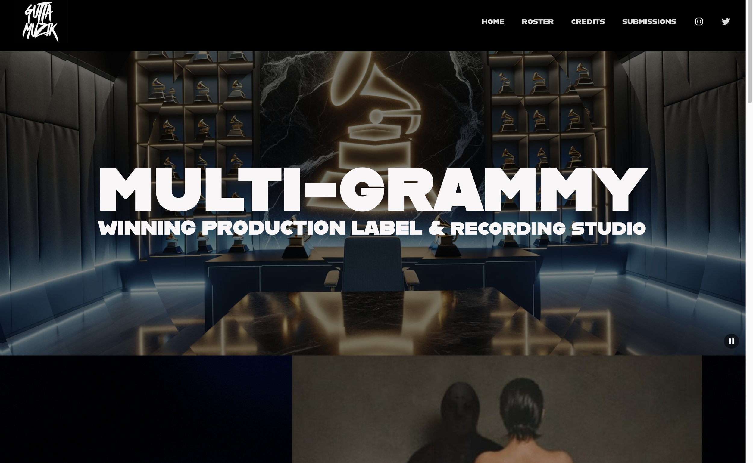 Homepage of GuttaMuzik featuring a modern recording studio with a large golden Grammy trophy illuminated on a black marble wall, surrounded by shelves with Grammy awards, having a futuristic dark interior with blue accent lighting.