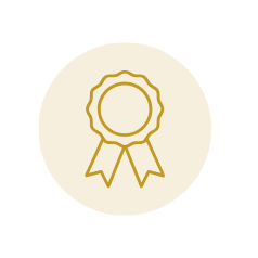 Gold medal with a ribbon hanging from it.