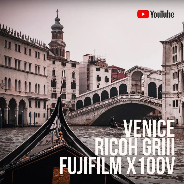 View of Venice canals with historic buildings, a bridge, and gondolas, as seen from a gondola.
