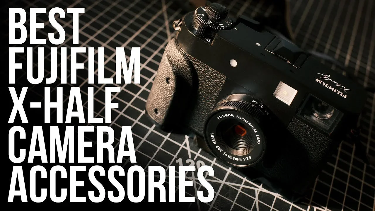 A Fujifilm X-Half camera with a black textured grip and a Fujinon aspherical lens, placed on a grid-patterned surface, with large white text overlay reading "Best Fujifilm X-Half Camera Accessories."