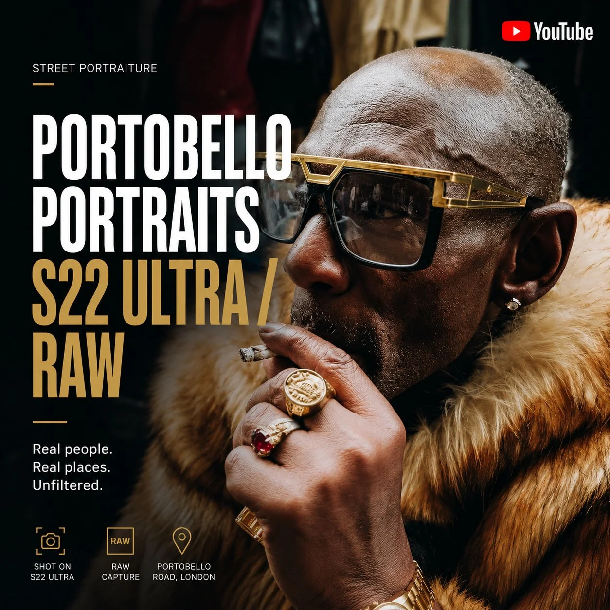 A man with dark skin and a partially shaved head is wearing large, stylish sunglasses with a gold frame and a fur coat. He is holding a lit cigar in his hand and has a diamond ring on his finger. The background appears to be a cluttered indoor space.