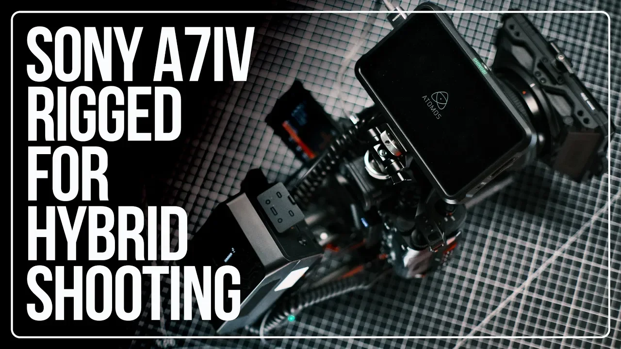 A professional camera with a mounted monitor displaying a logo that says 'ATOMS' on a checkered surface.