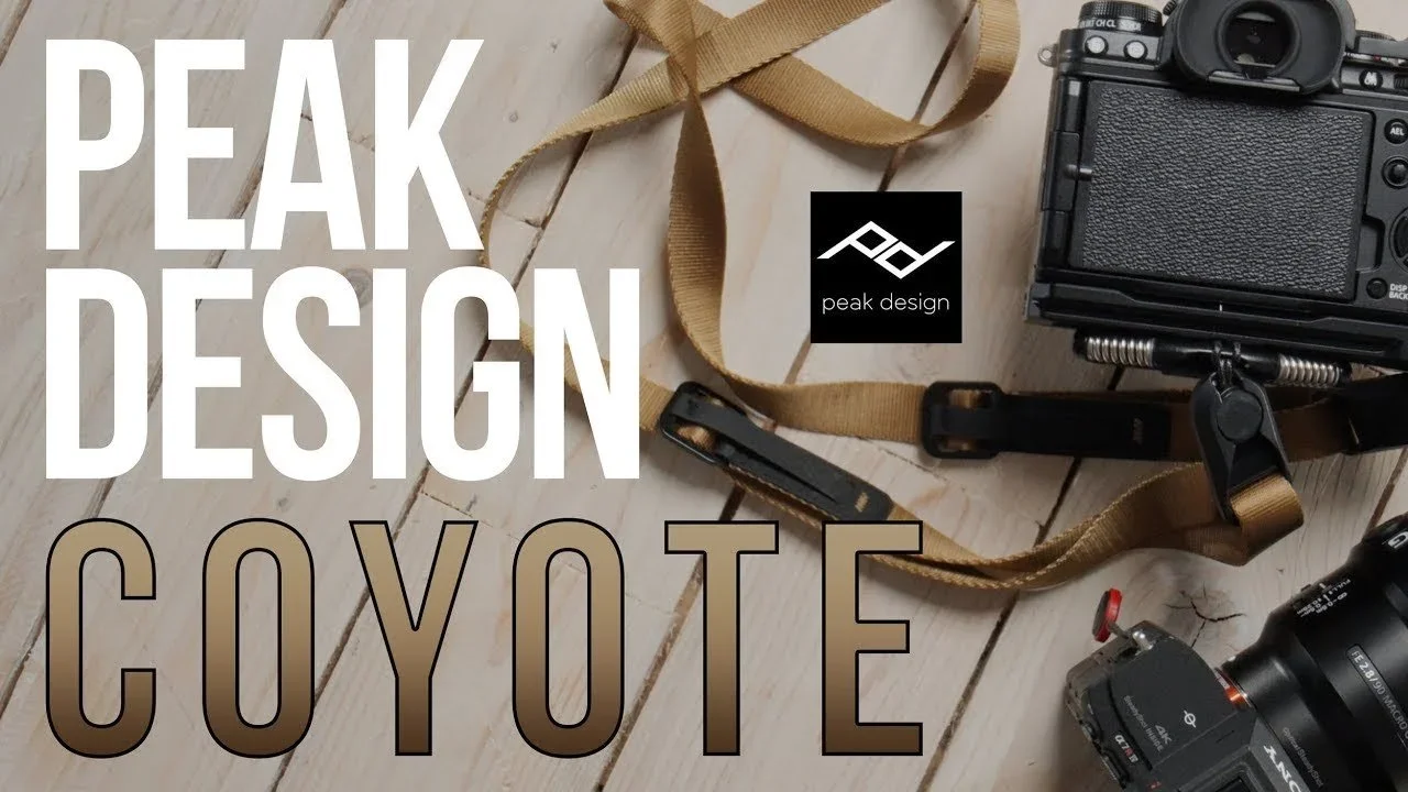 Camera equipment and accessories, including a camera, lens, and strap, are arranged on a wooden surface with the text "Peak Design Coyote" and a Peak Design logo overlayed.