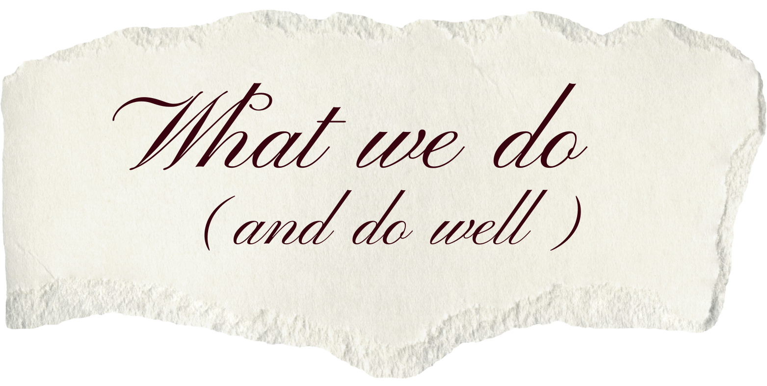 Torn piece of paper with the phrase 'What we do ( and do well )' written in elegant cursive font.