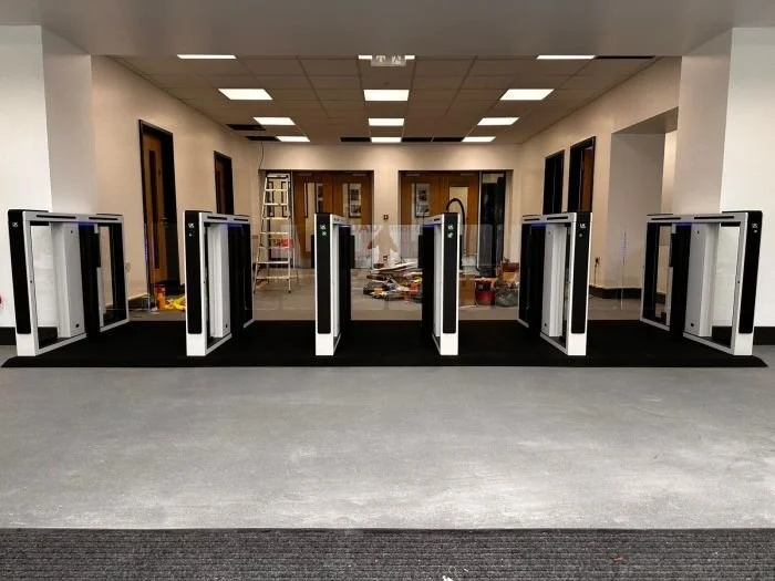 Entrance with security turnstiles in an office building under construction