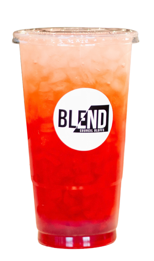 A cold, icy red and pink drink in a plastic cup with a clear lid, featuring a circular logo that says "BLEND Council Bluffs" on the front.