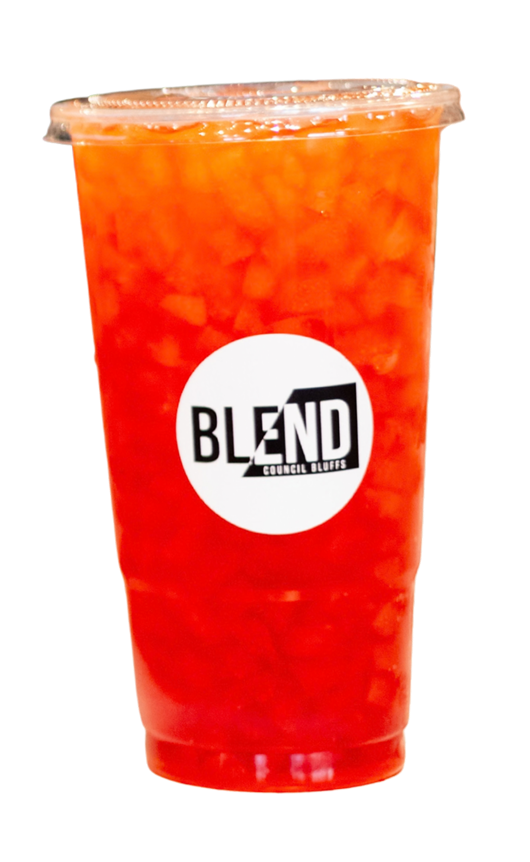 A large red and orange blended fruit drink in a clear plastic cup with a lid, featuring a white circular logo that says 'BLEND' and 'Council Bluffs'.