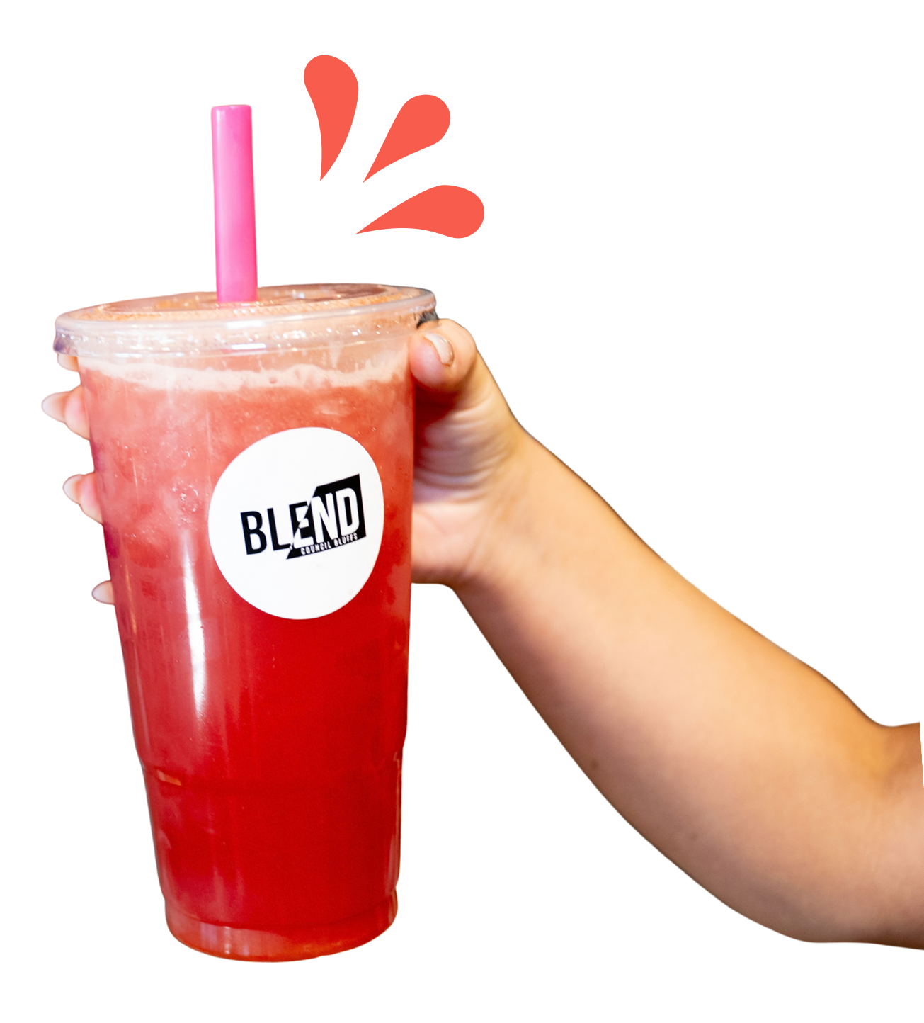 A hand holding a large pink smoothie with a straw and a 'BLEND' brand sticker on the cup.
