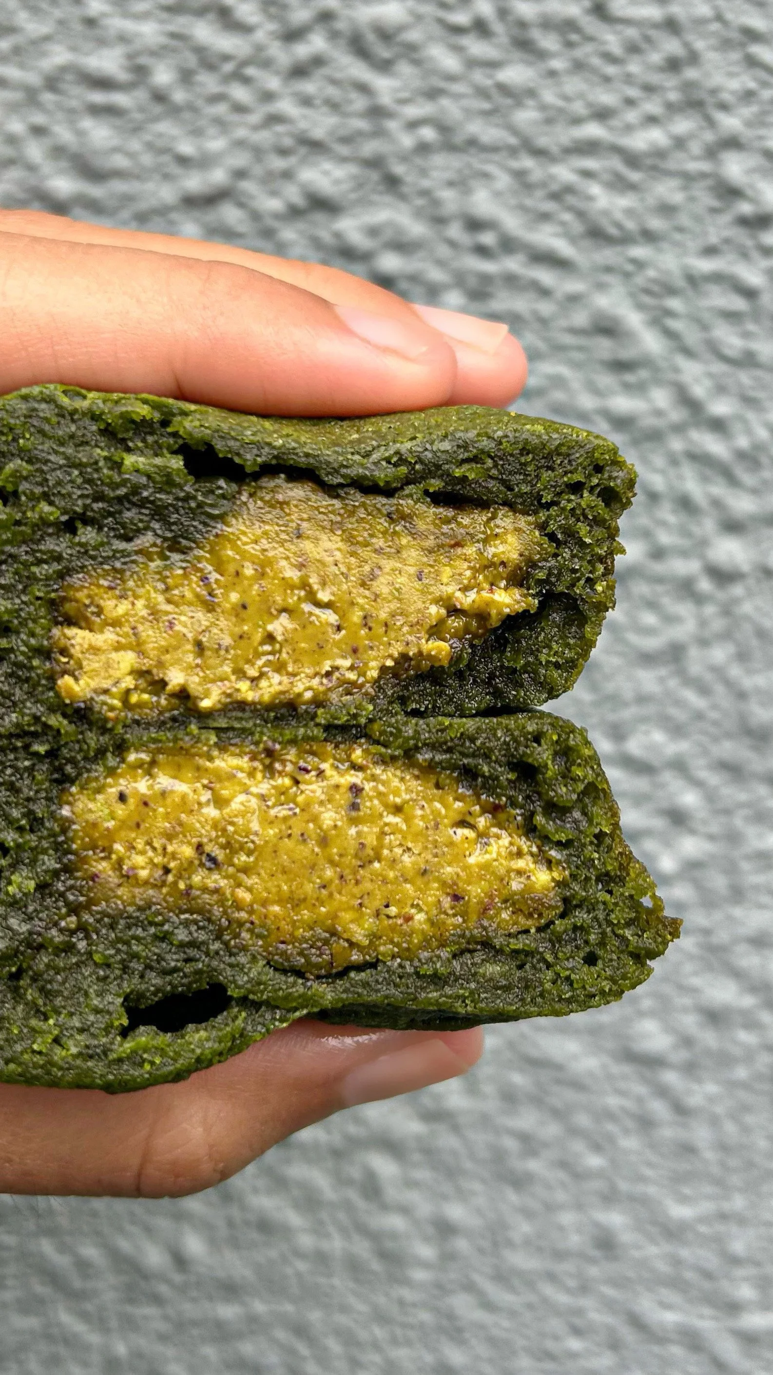 Fudgy matcha brownie with pistachio filling made with ceremonial-grade matcha from a Singapore matcha bakery.