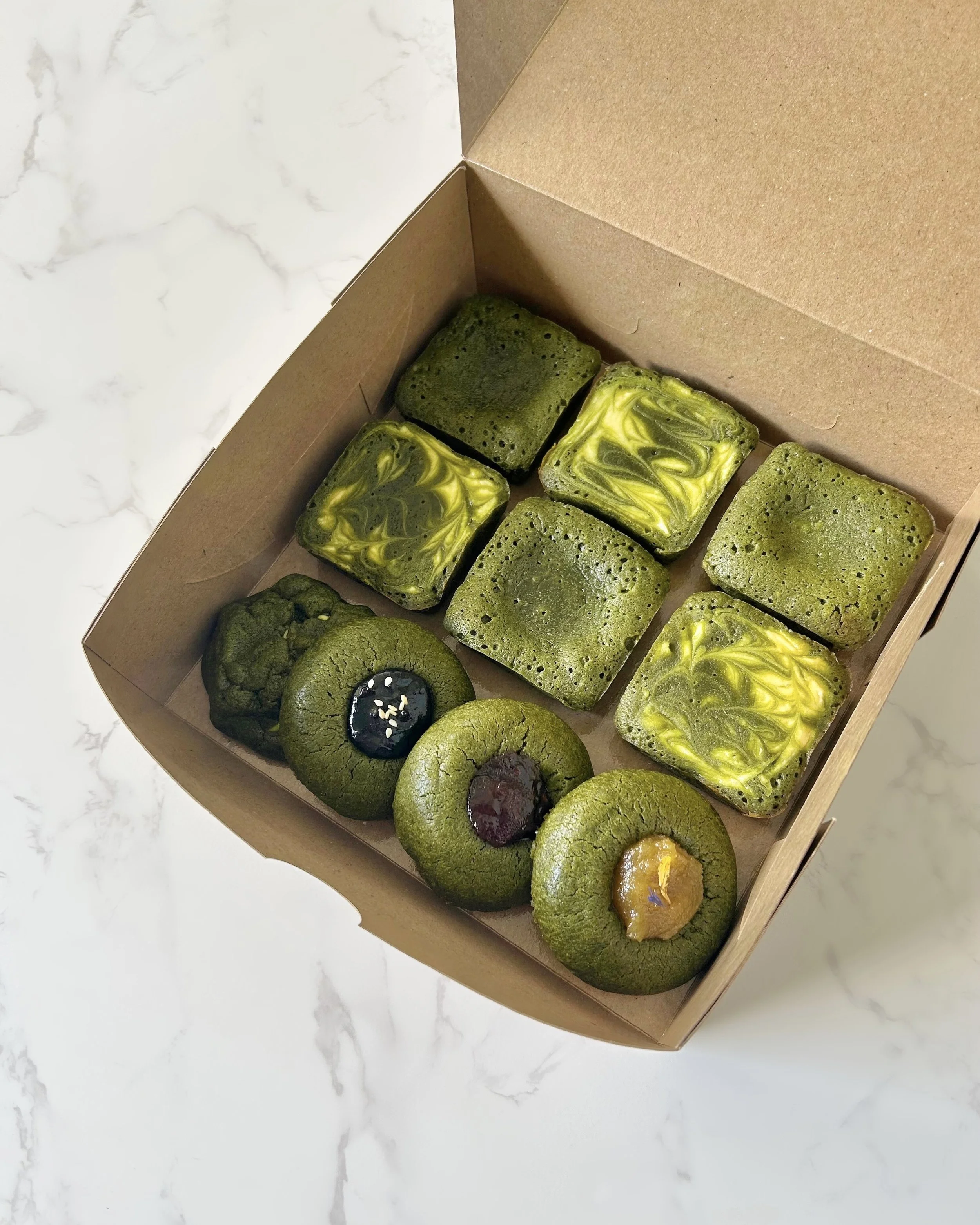 Assorted fudgy matcha brownies and matcha cookies from a Singapore home-based matcha bakery.