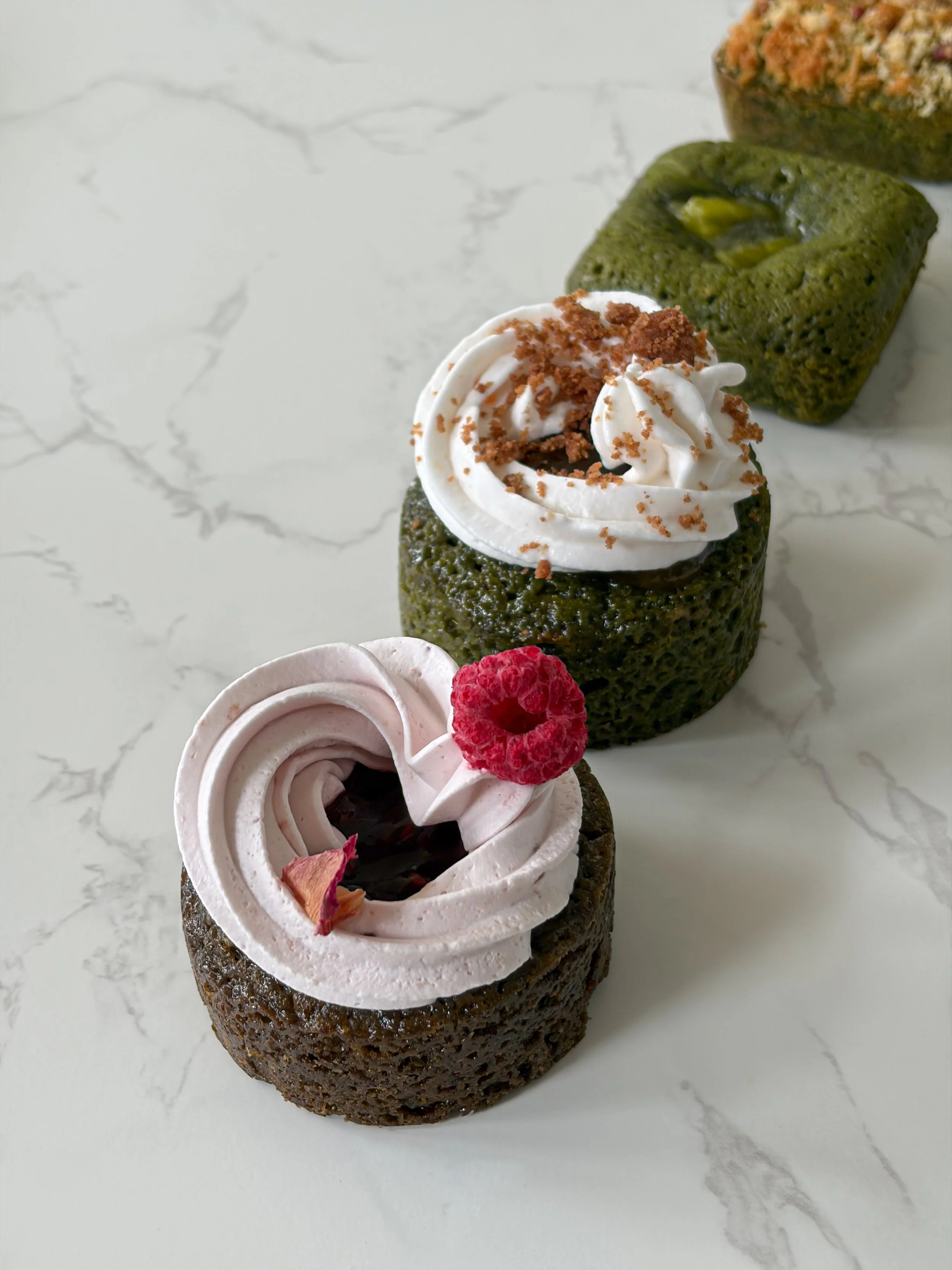 Assorted matcha brownies, matcha gateau cakes, and hojicha gateau cakes made with ceremonial-grade matcha and dark roasted hojicha powder.