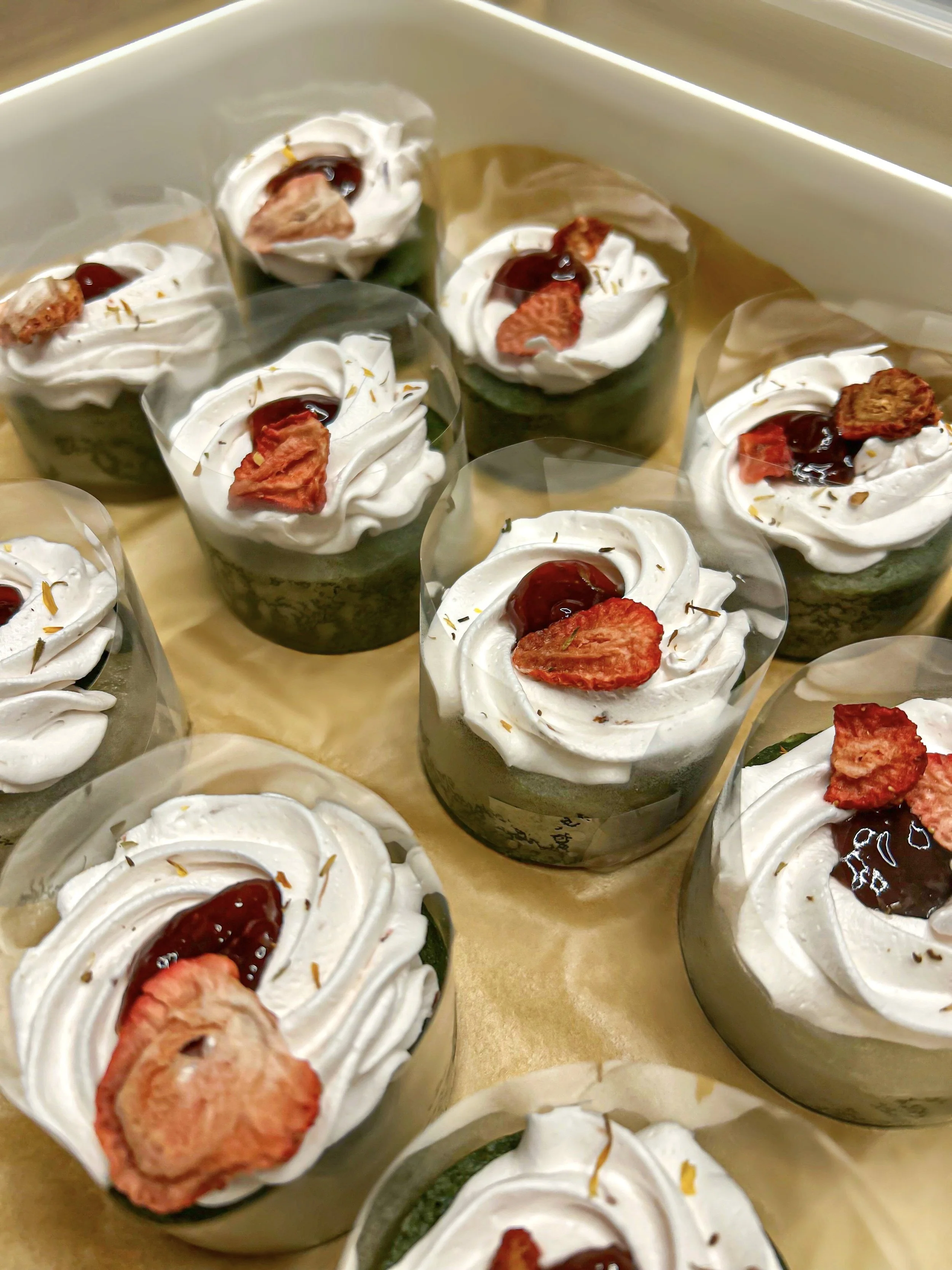 Matcha strawberry gateau cake with strawberry compote and strawberry-infused cream, topped with edible flowers and made with ceremonial-grade matcha from a Singapore home-based matcha bakery.